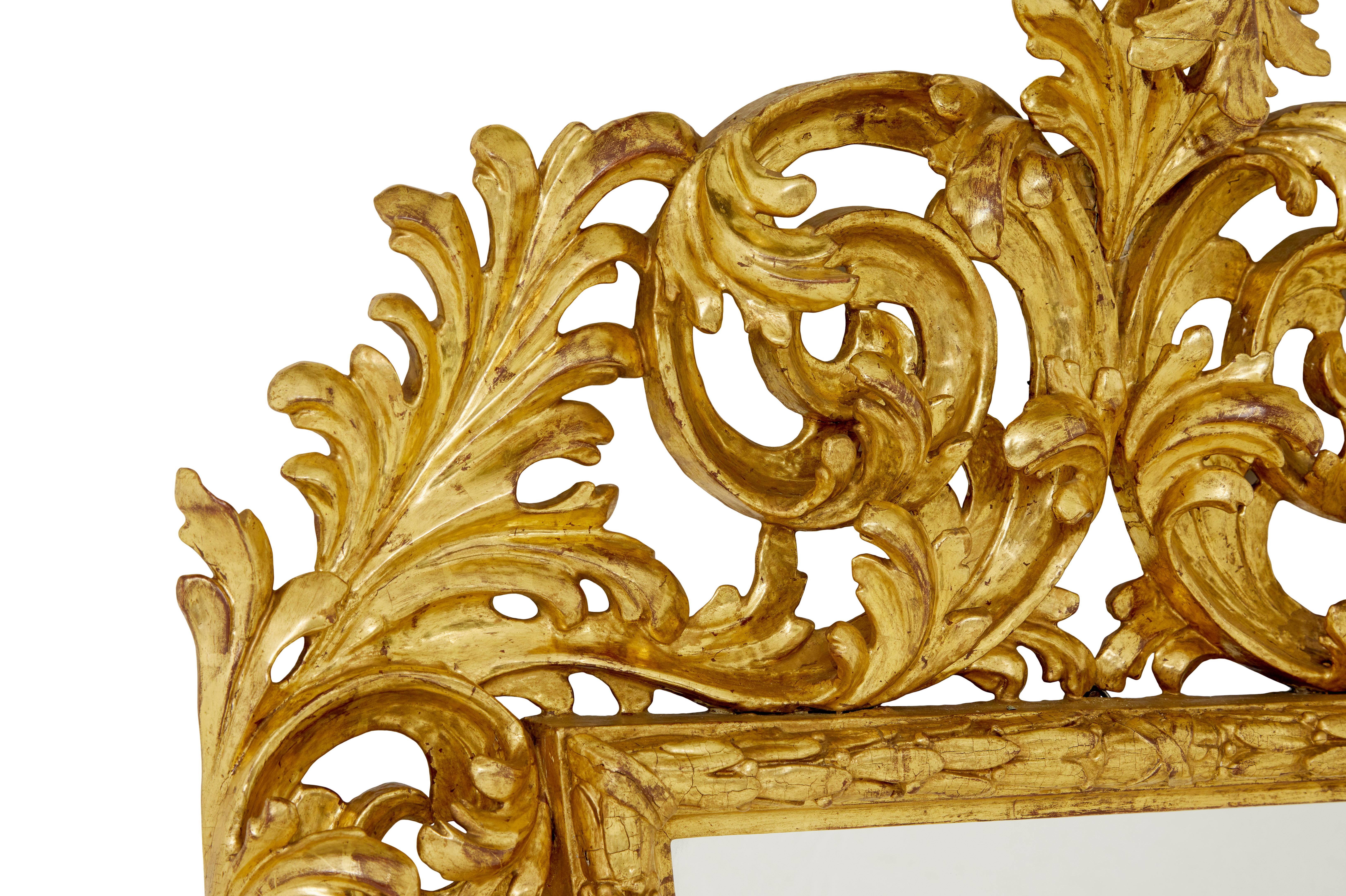 Rococo 18th century carved Italian rococo giltwood mirror For Sale