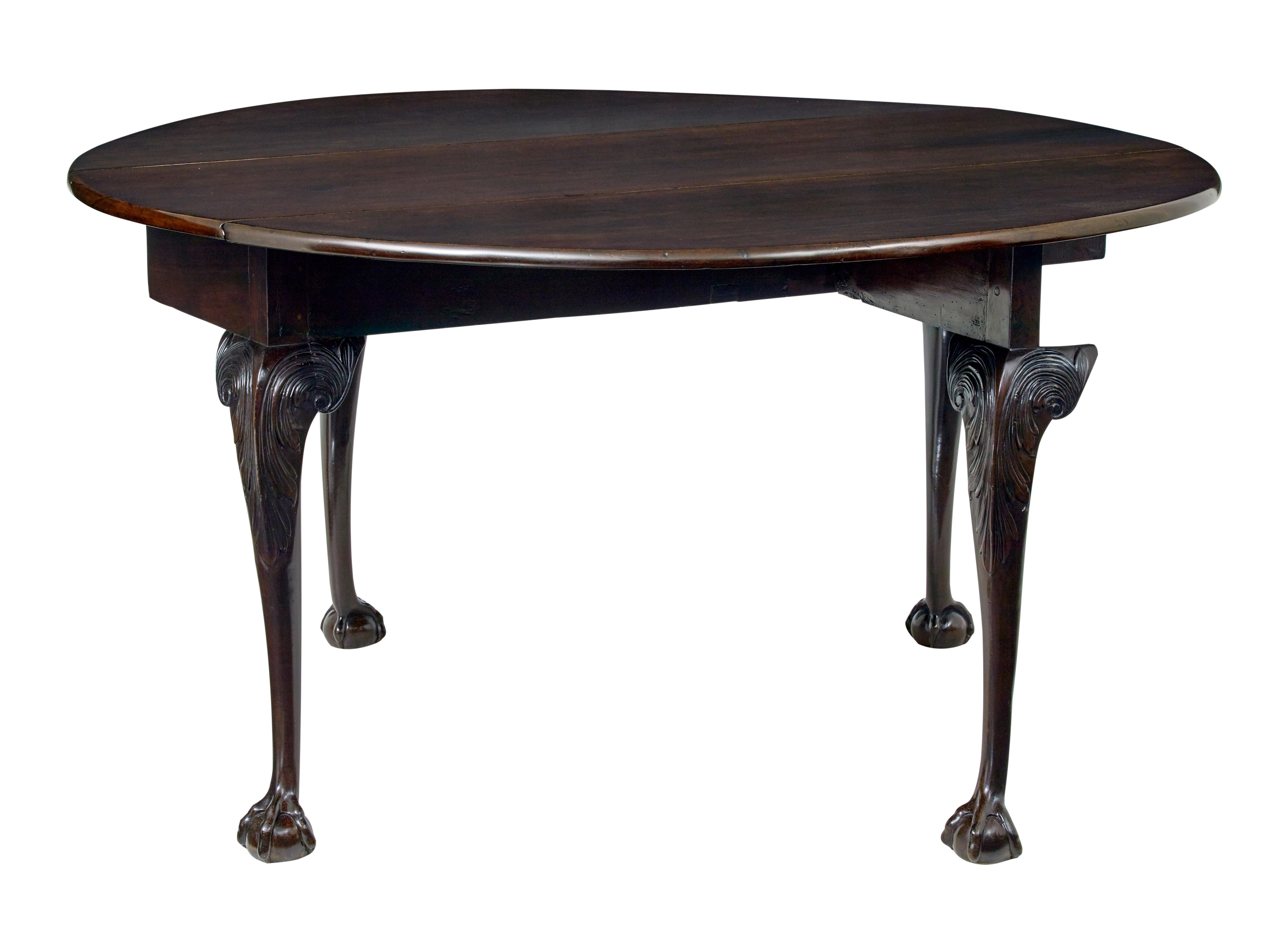 Fine quality drop leaf table from the end of the Chippendale period circa 1780.

Solid mahogany top which forms a near circle when opened out. Swing out legs each side provide support the leaves for it to perform as an occasional dining table.