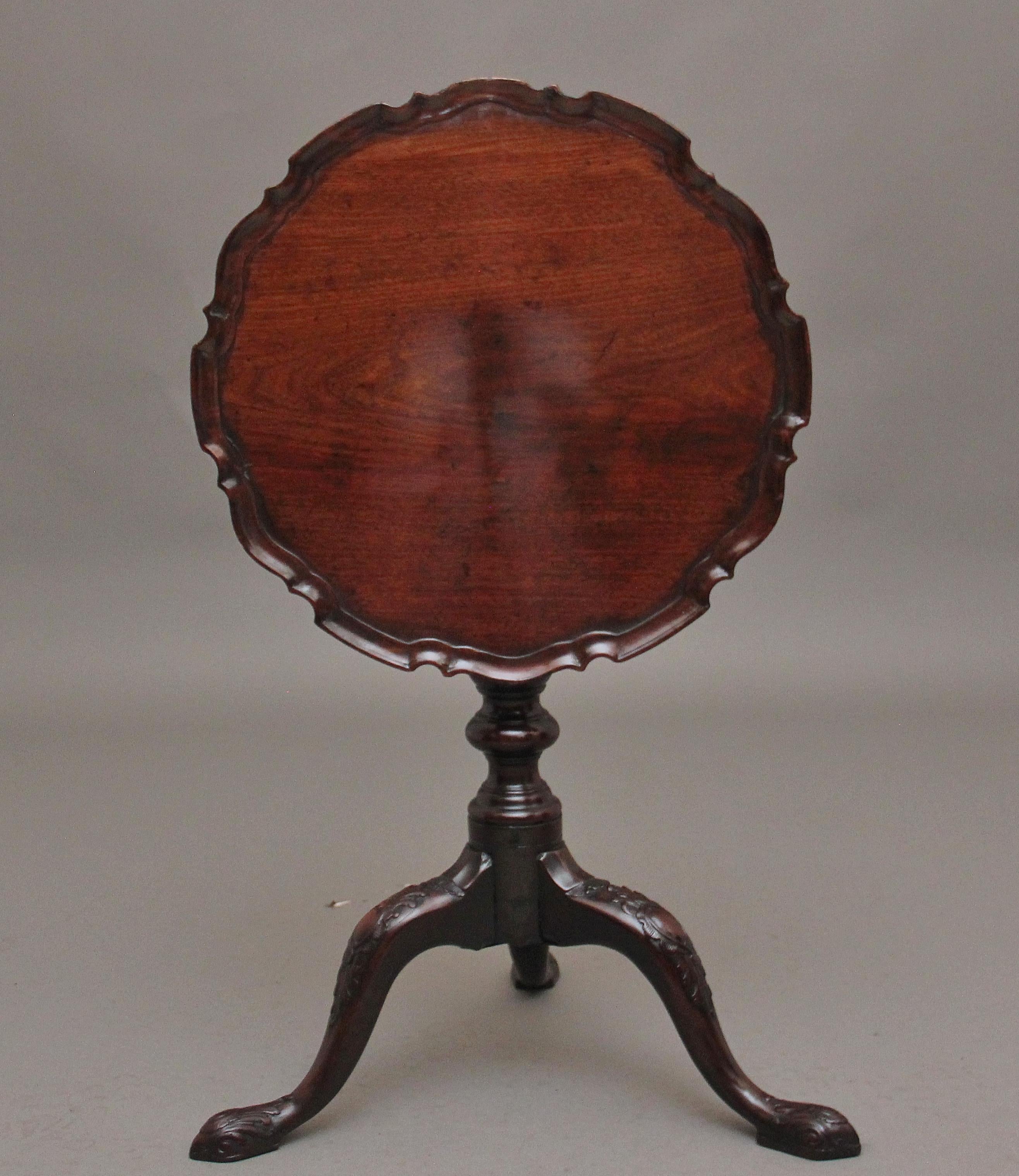 18th Century mahogany tripod table having a wonderfully figured top with a piecrust edge, supported on an elegant turned column terminating with three slender shaped and carved legs.  Having a lovely warm rich mahogany colour and in excellent