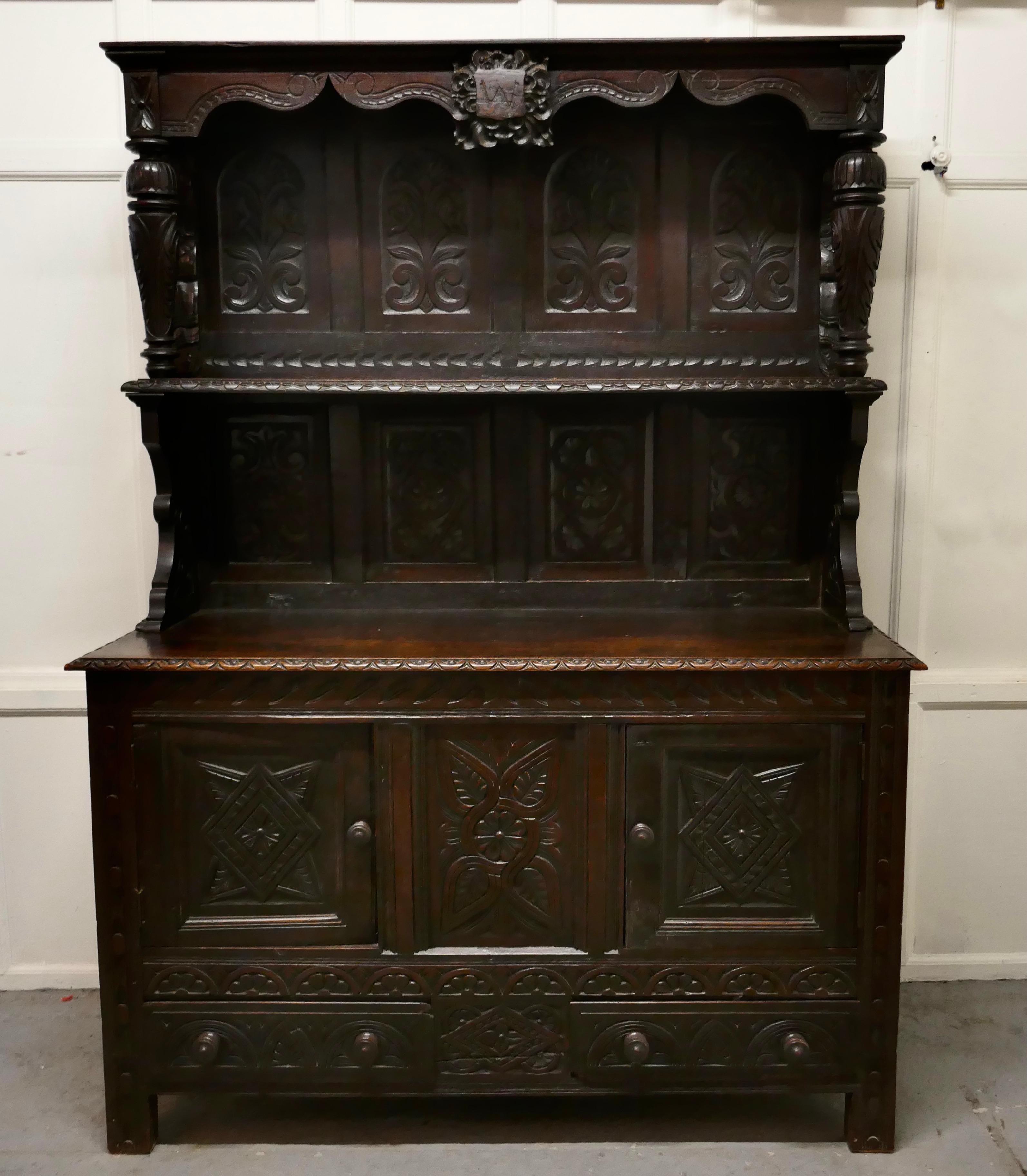 18th century carved oak buffet sideboard dresser.


This is a handsome piece with a wonderful patina, the carving is of very fine quality, the very top section is even older it dates from the 17th century
This section has the portrait of a king