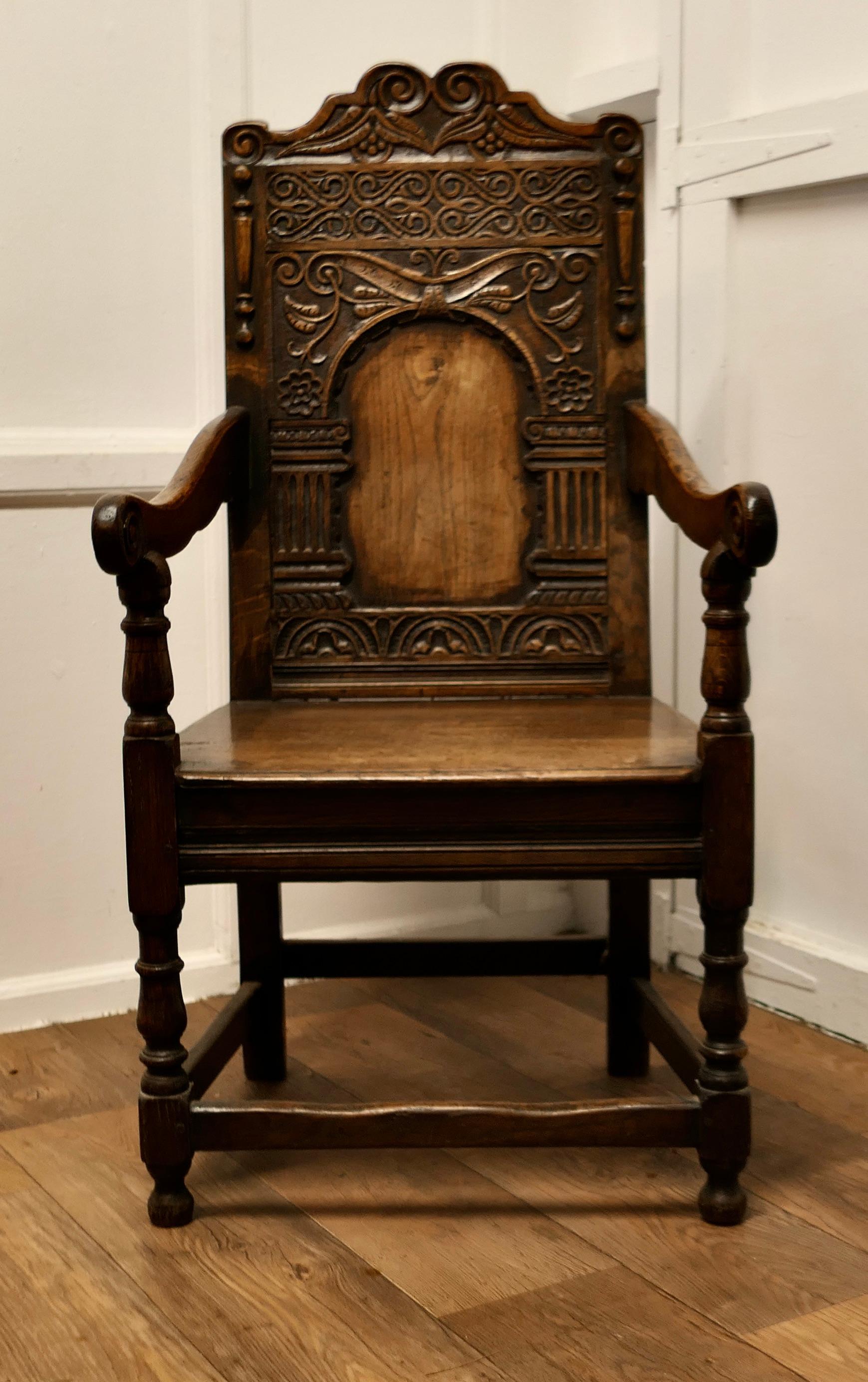 18. Jahrhundert Eiche geschnitzt Celtic Wainscot Stuhl

Dieser hübsche Stuhl hat eine wunderbare Patina, er hat einen massiven Plankensitz, gedrechselte Beine und geschnitzte Armlehnen. Die dekorative, hohe Thronlehne ist tief geschnitzt mit den