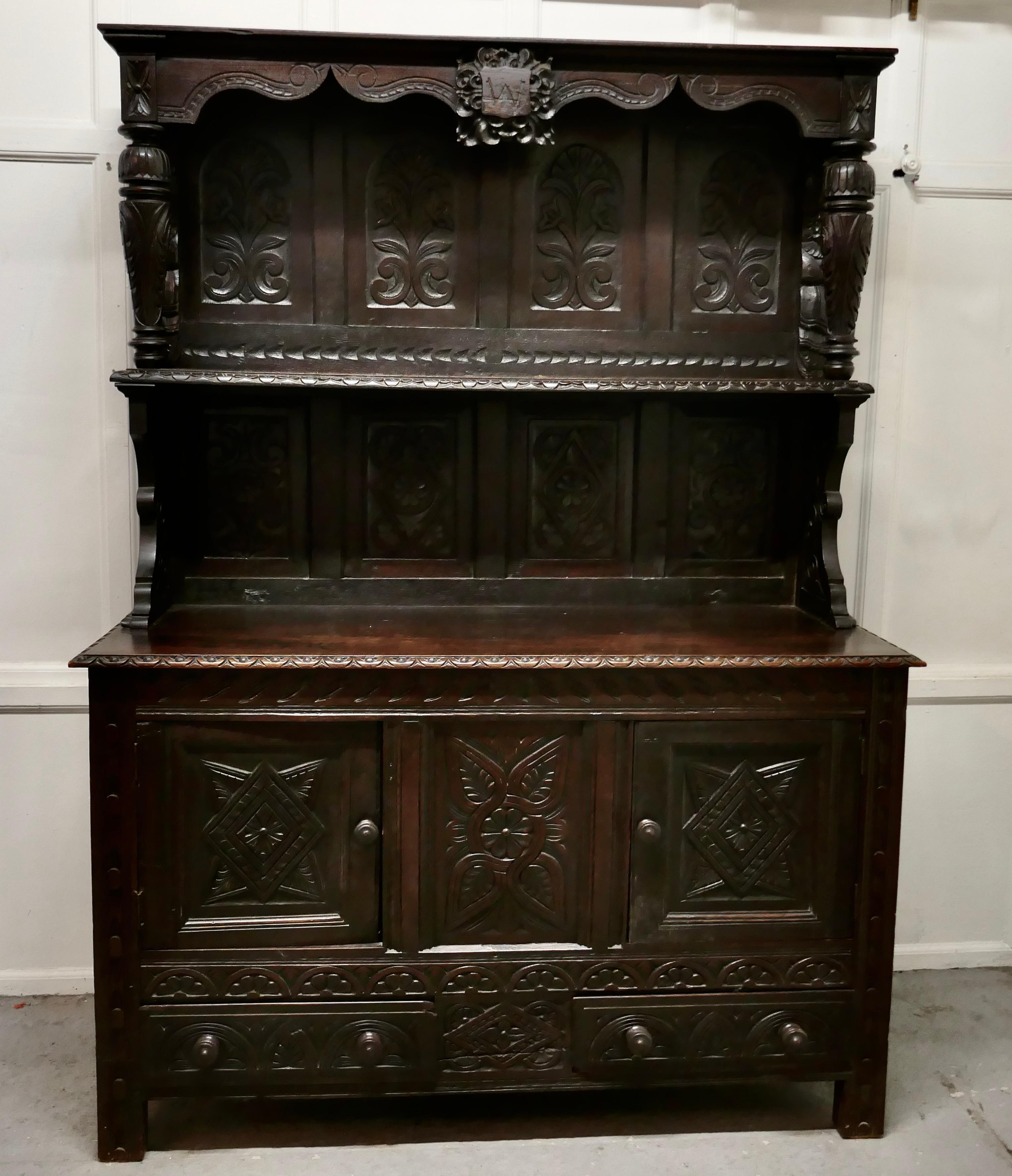 18th Century Carved Oak Dresser with Kings


This is a handsome piece with a wonderful patina, the carving is of very fine quality, the very top section is even older it dates from the 17th Century
This section has the portrait of a king carved on