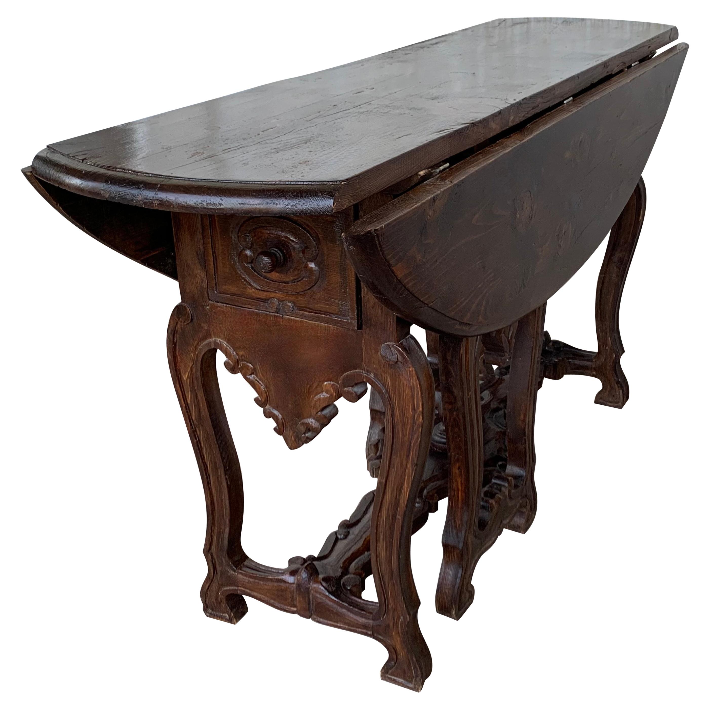 Ovaler Tisch mit Schubladen und Leierbeinen aus geschnitzter Eiche aus dem 18. Jahrhundert