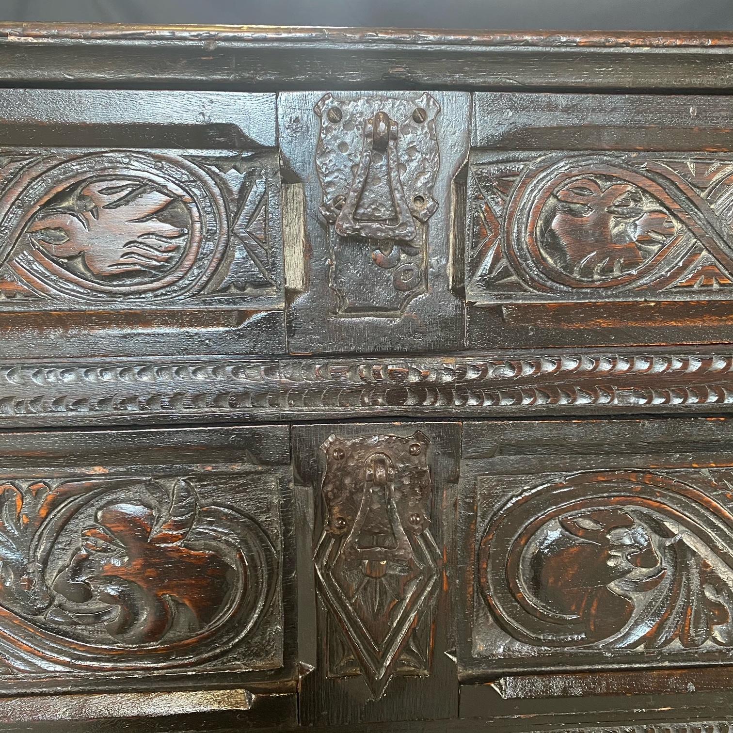 Rare and early 18th century intricately carved oak chest of drawers or commode depicting a story with kings and dragons with a thistle frieze. Bought in Scotland. Paneled sides and two plank back support the beautifully carved front of the chest,