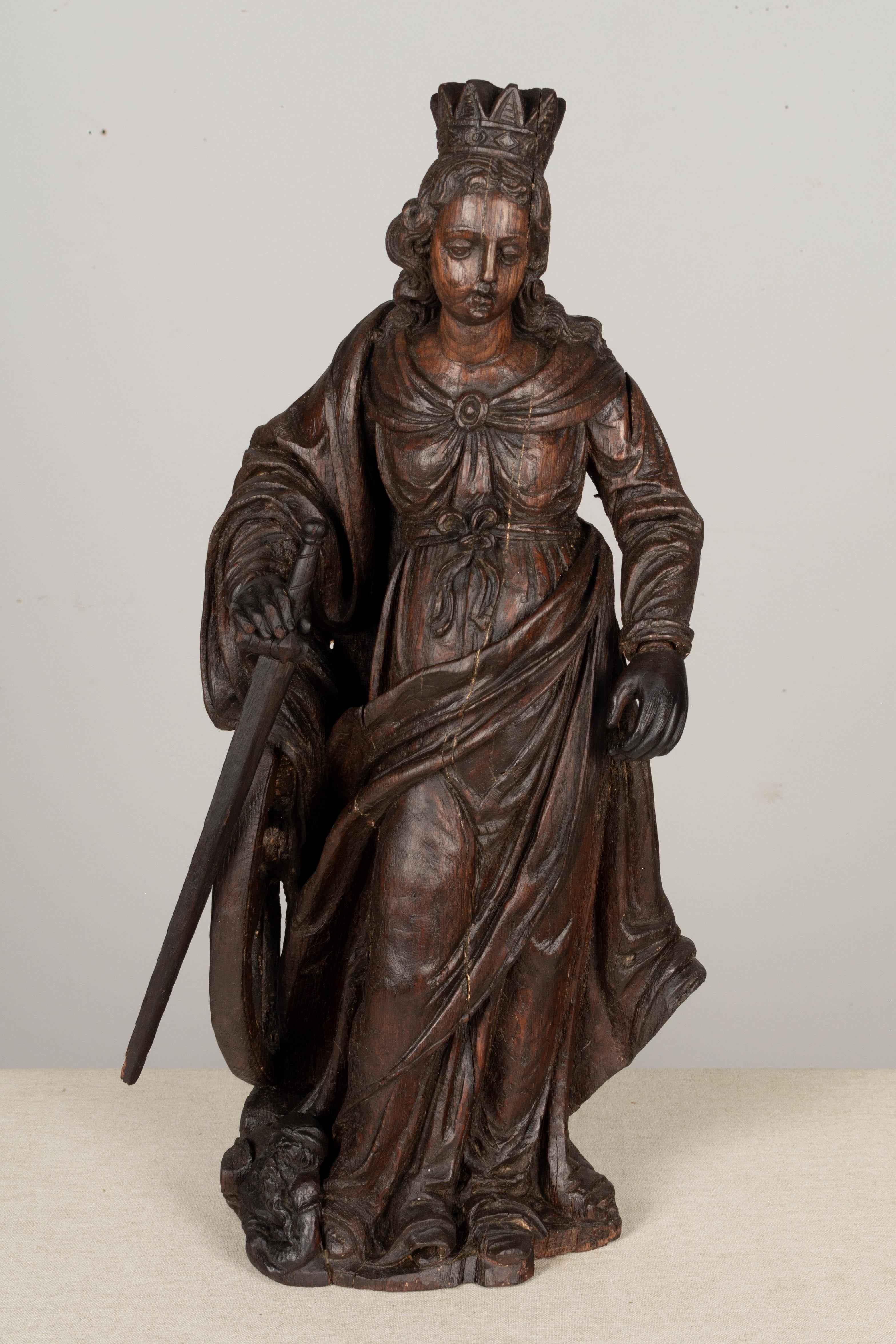 German 18th Century Carved Oak Statue of Saint Catherine of Alexandria For Sale