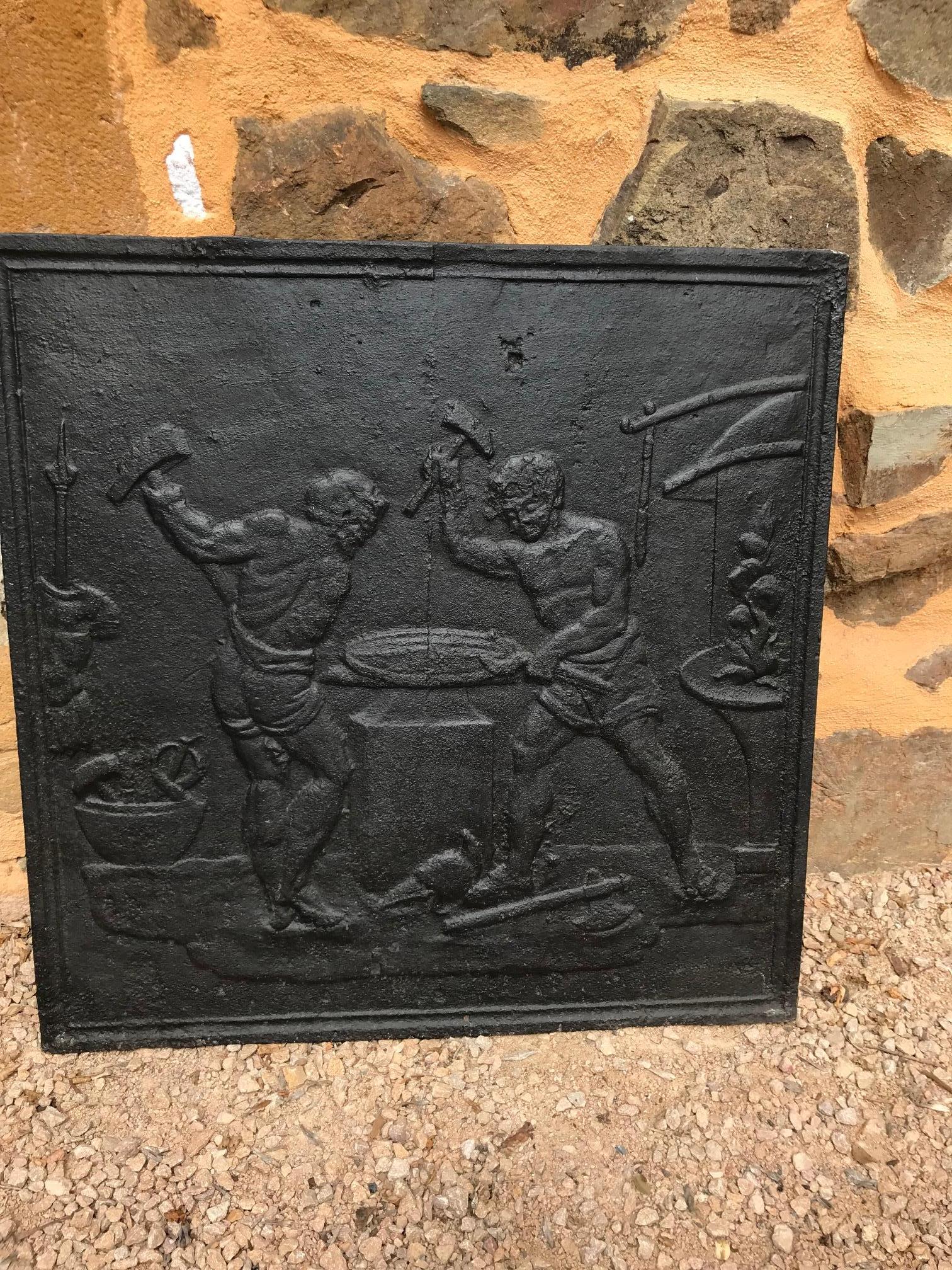 Beautiful 18th century cast iron fireplace Screen representing Greek working black-smith.
There is a Greek armor on the left and the fireplace on the right.
Rare piece in very good condition.