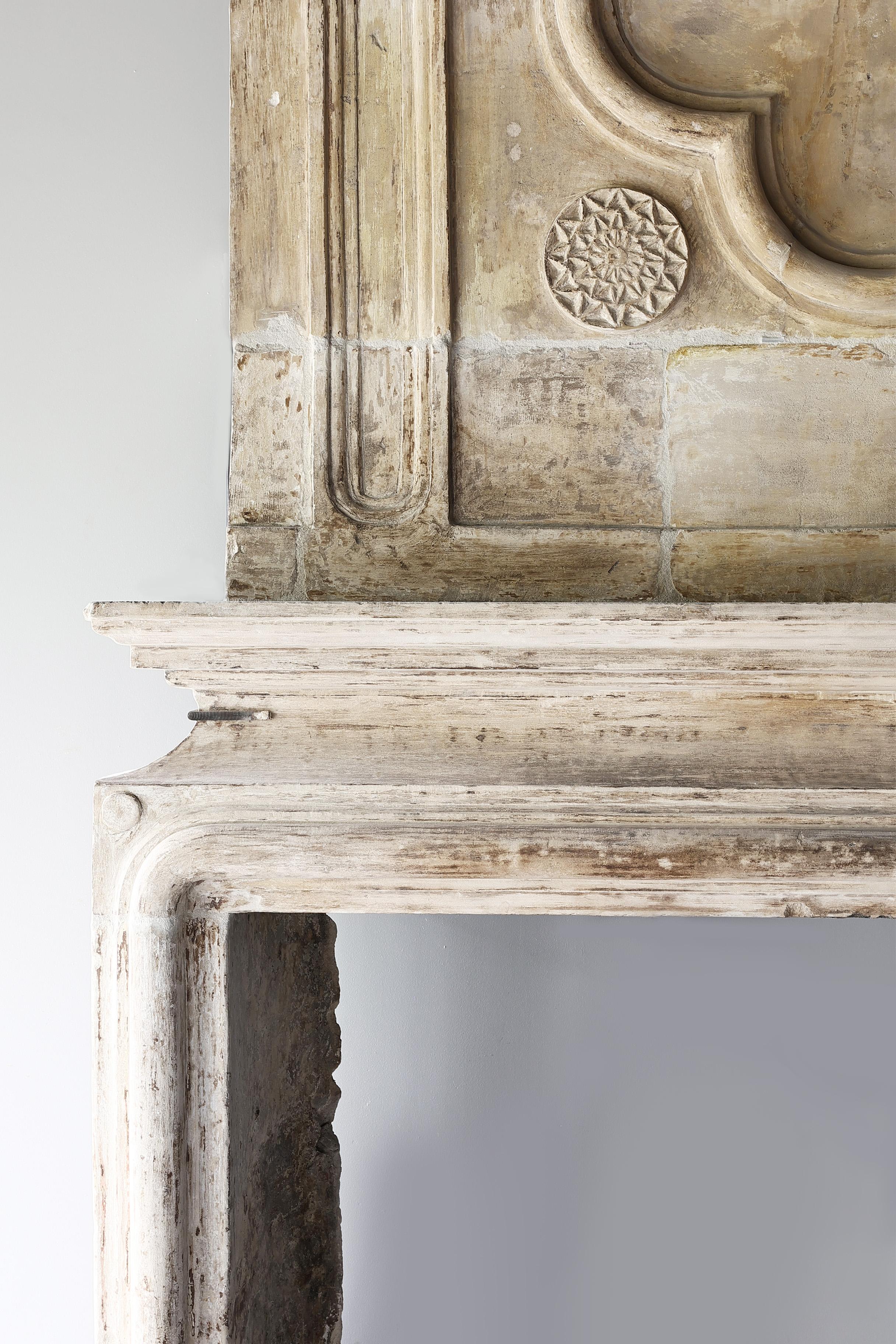 18th century castle fireplace of french limestone with trumeau Louis XIV 2