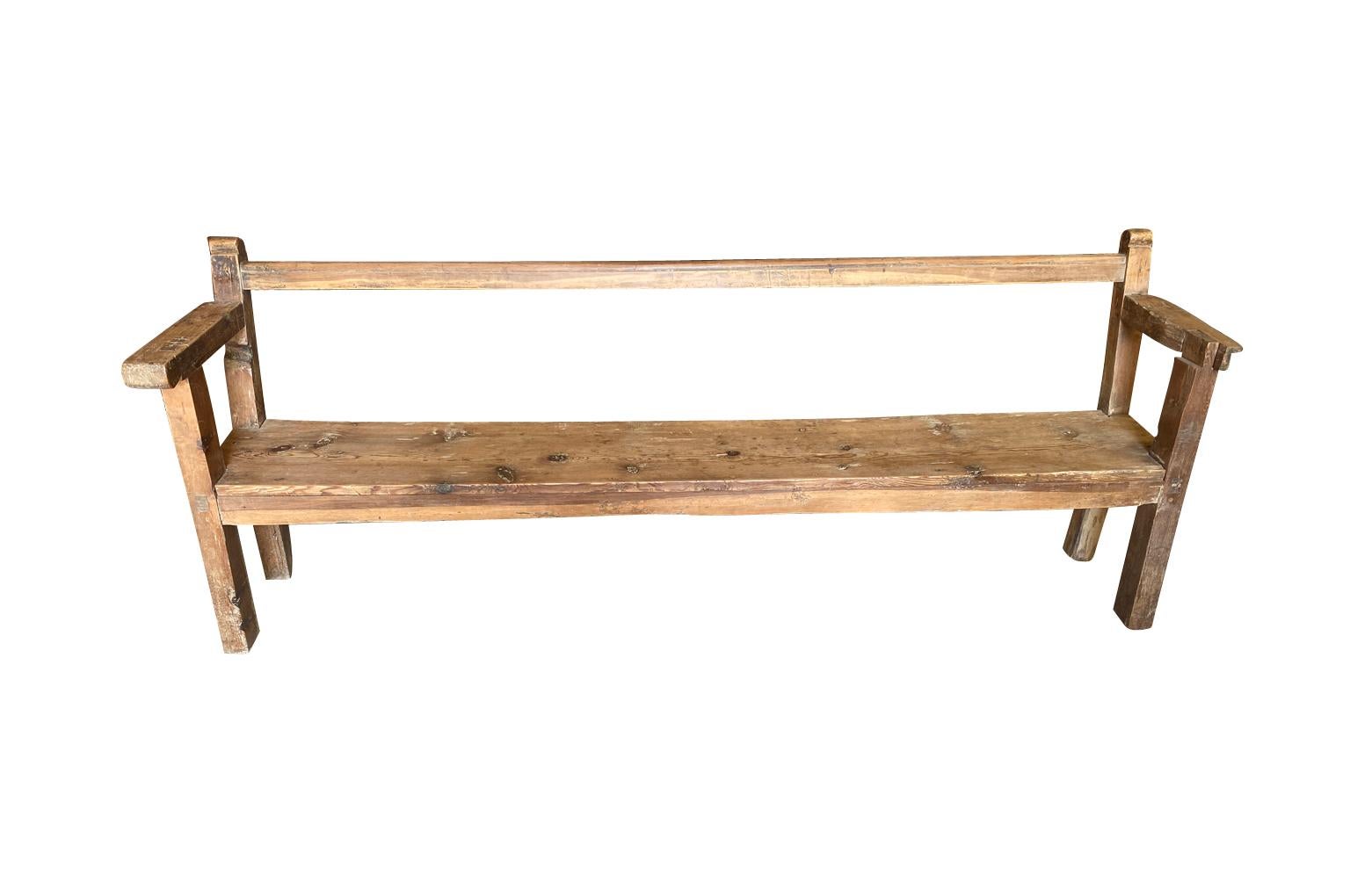 A very handsome 18th century primitive bench from the Catalan region of Spain.  Nicely constructed from Meleze - a very dense pine.  Very rich patina.  The seat height is 16 5/8