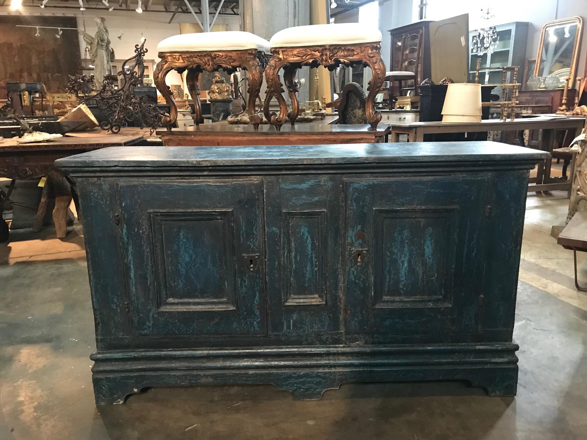 A wonderful 18th century buffet cabinet from the Catalan region of Spain. Soundly constructed from very thick planks of painted oak. Terrific painted finish in hues from azure to turquoise. A wonderful storage piece that will add charm and character