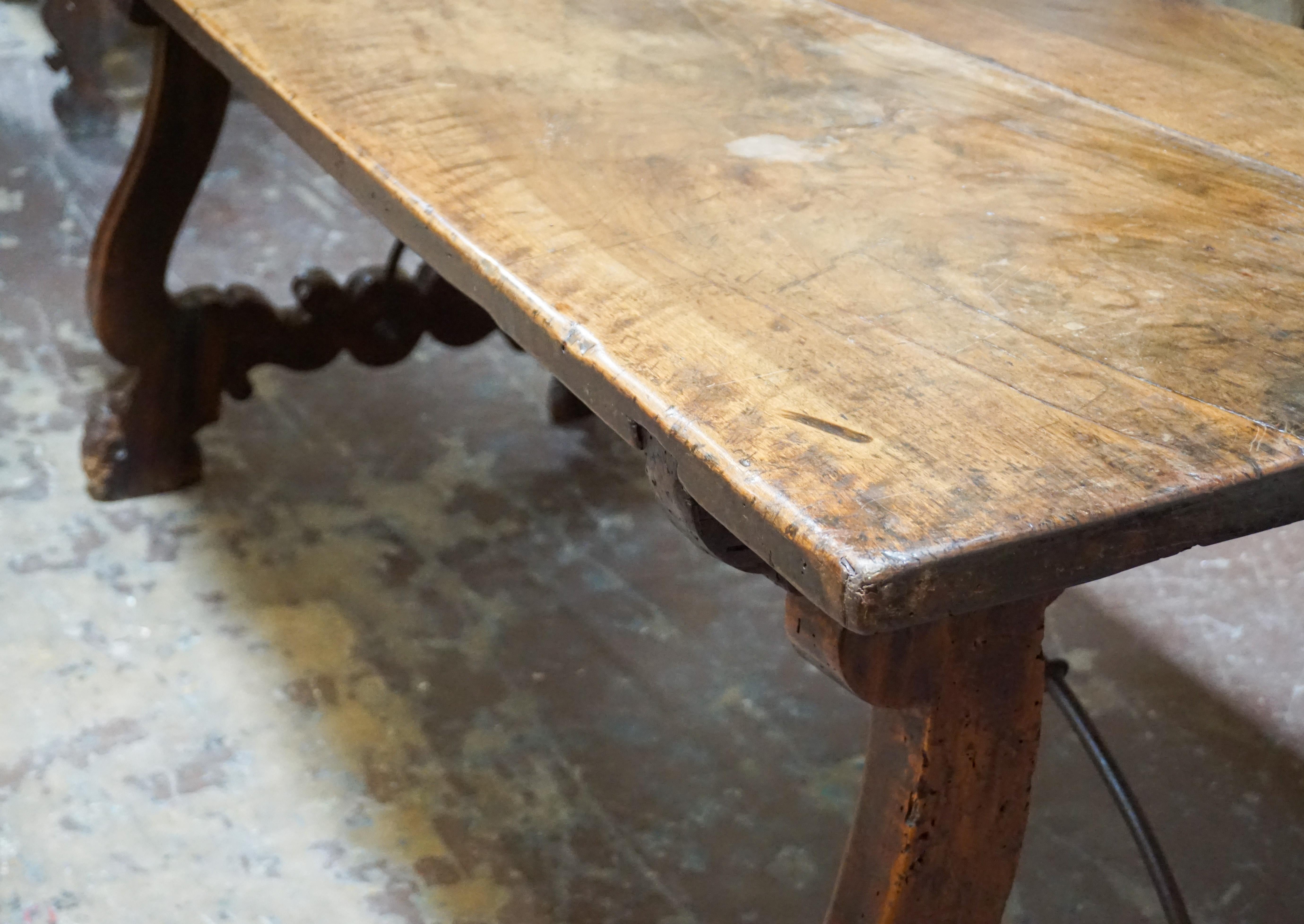 A beautiful dining table from Spain circa 1750. Made of walnut wood.

Measurements: 30.75'' D x 76.25'' W x 32'' H.