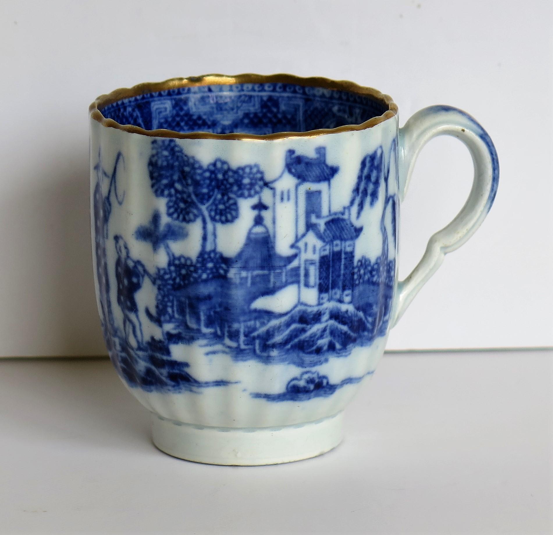 This is an excellent example of a pearlware pottery coffee cup made by the Caughley factory, Shropshire, England.

The coffee cup is made of pearlware pottery and is vertically fluted with a wavy rim and a distinctive kinked handle with an inward