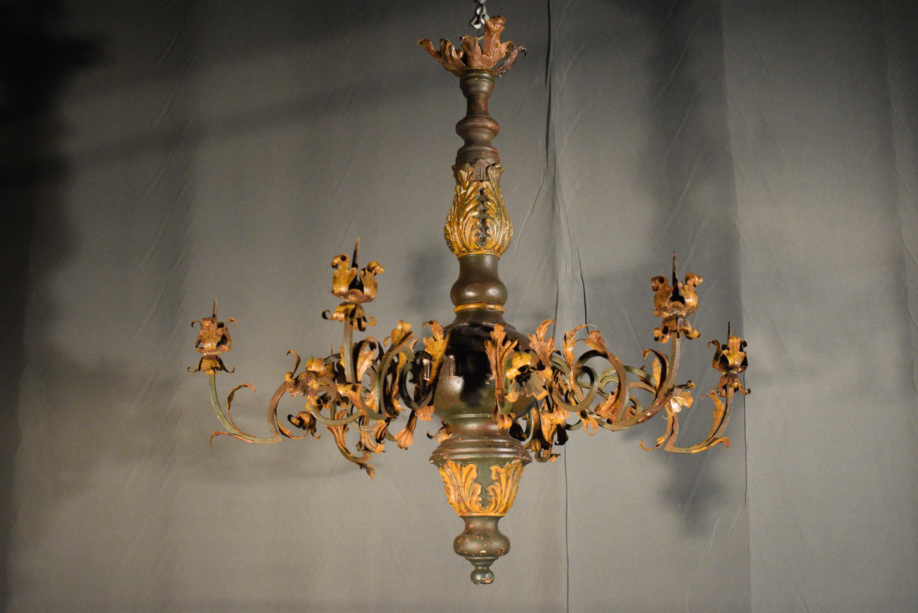 A very fine 18th century Italian chandelier originally for candles. Wood (partially gilt) iron and gilt bronze (top canopy) pair available. A rare find.
Dimensions: Height 33