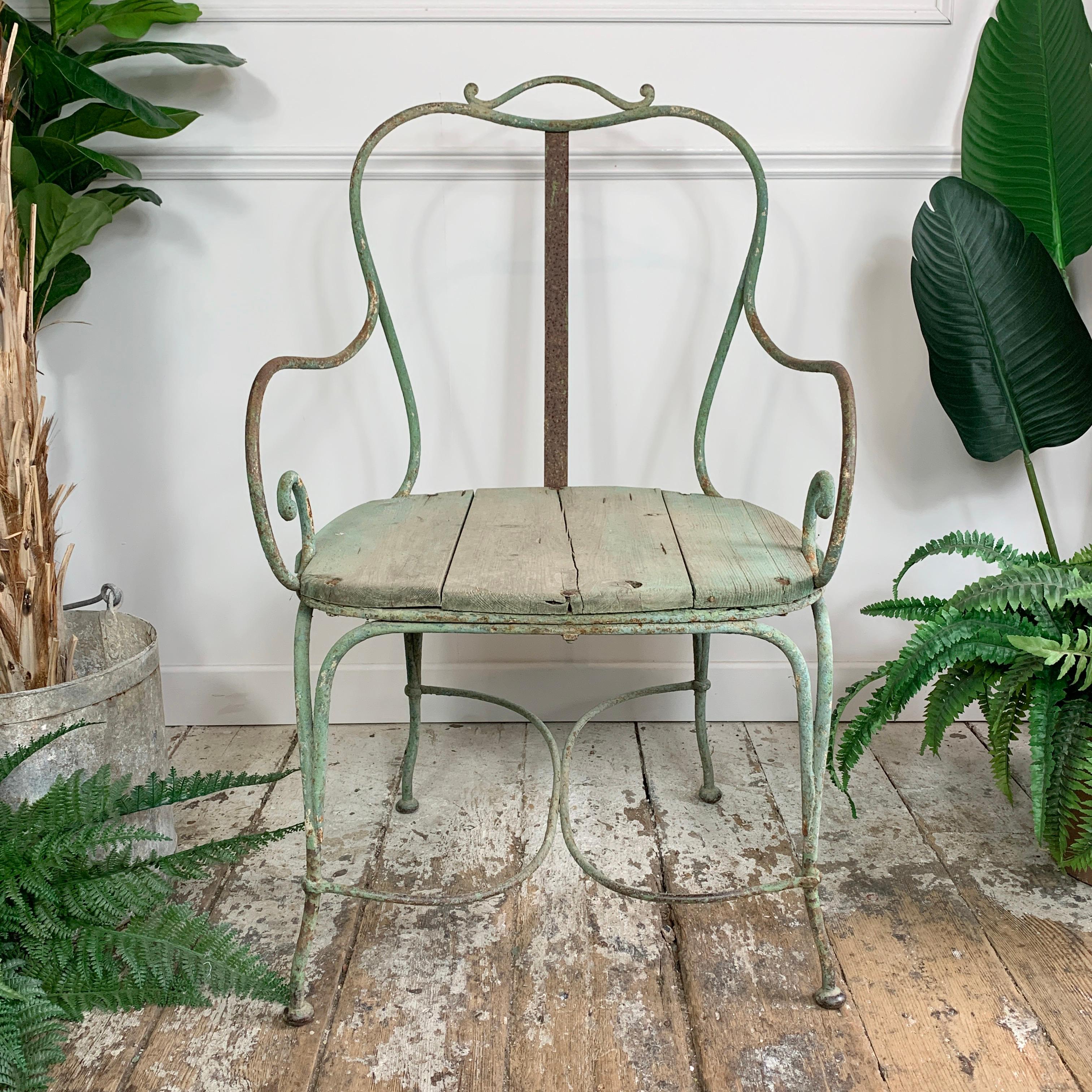 18th century French Régence estate made ironwork Chateau arm chair of great proportions, blacksmith hammered weld scroll arms and French cabriole legs, the wooden seat, a likely 19th century replacement is in very good order. Traces of the original
