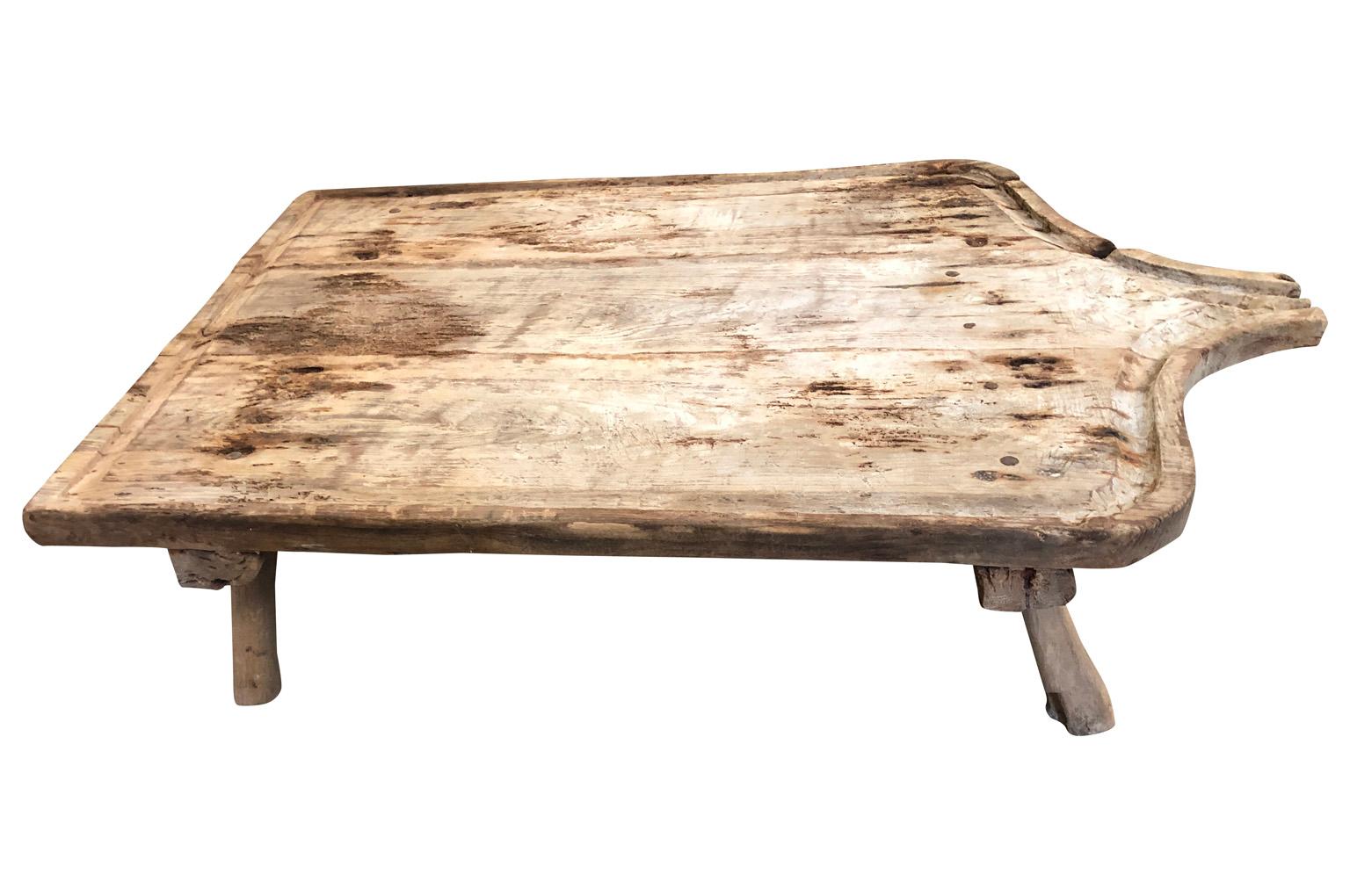 A wonderful Primitive 18th century grand scale cheese making board table - coffee table - from the Provenance region of France. Soundly constructed from naturally washed wood. A wonderful coffee table for any casual indoor or outdoor environment.