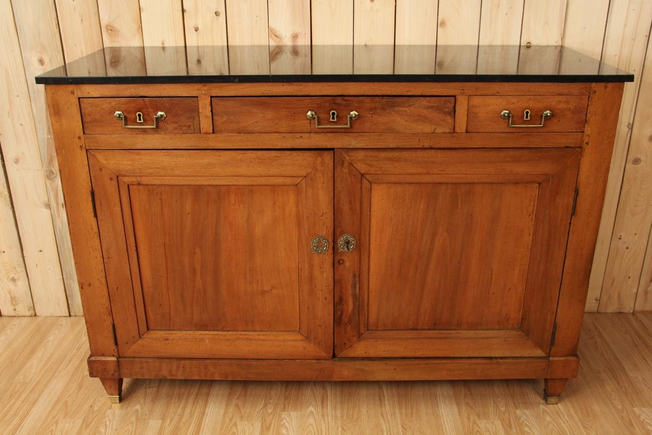 Buffet in solid cherry wood from the Louis XVI period with its period black marble top. Missing drawer locks.