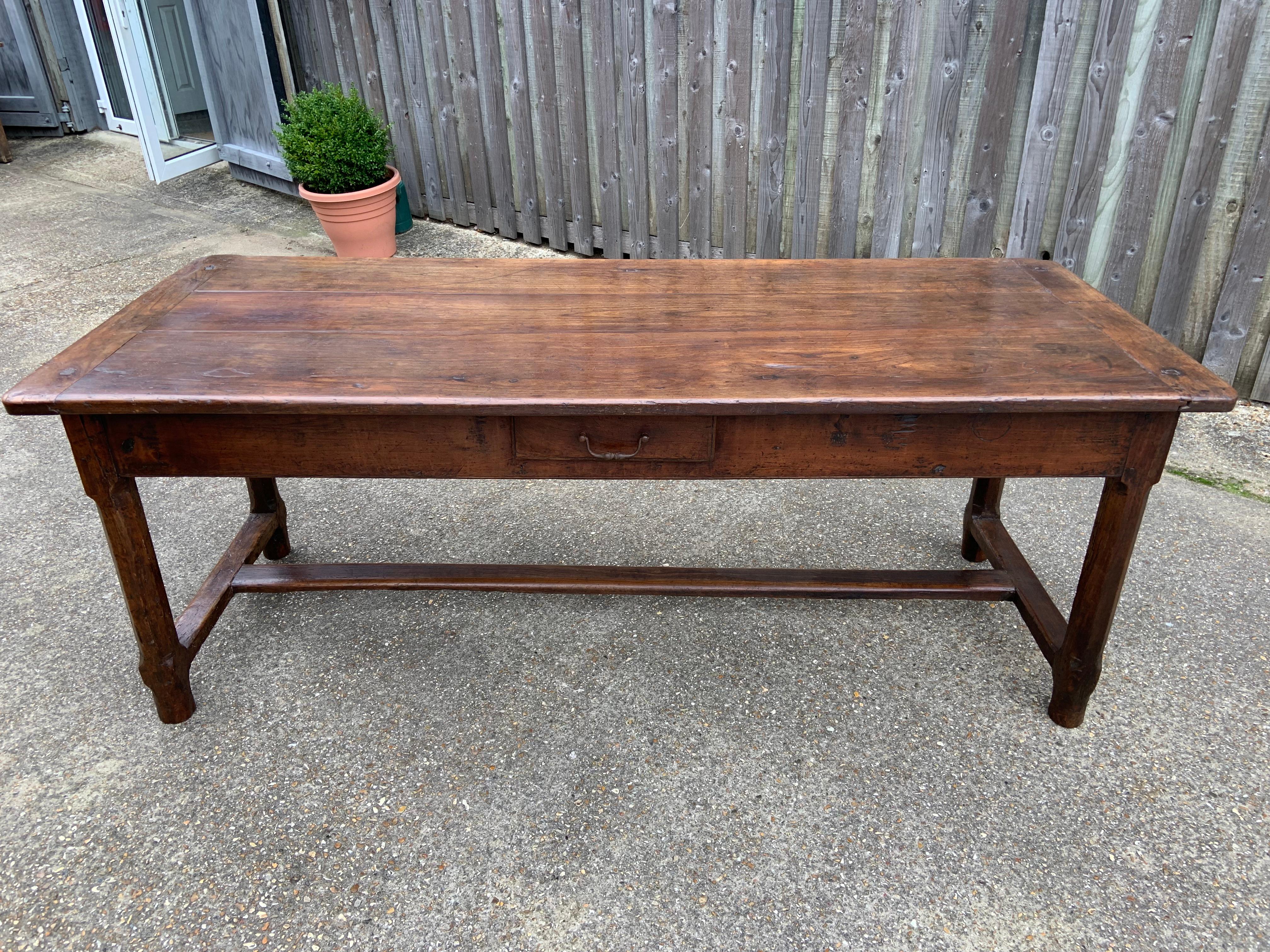 18th century Cherry farmhouse table with wonderful patination. The table sits on a sturdy apron and has a centre stretcher. The table has two gorgeous drawers.