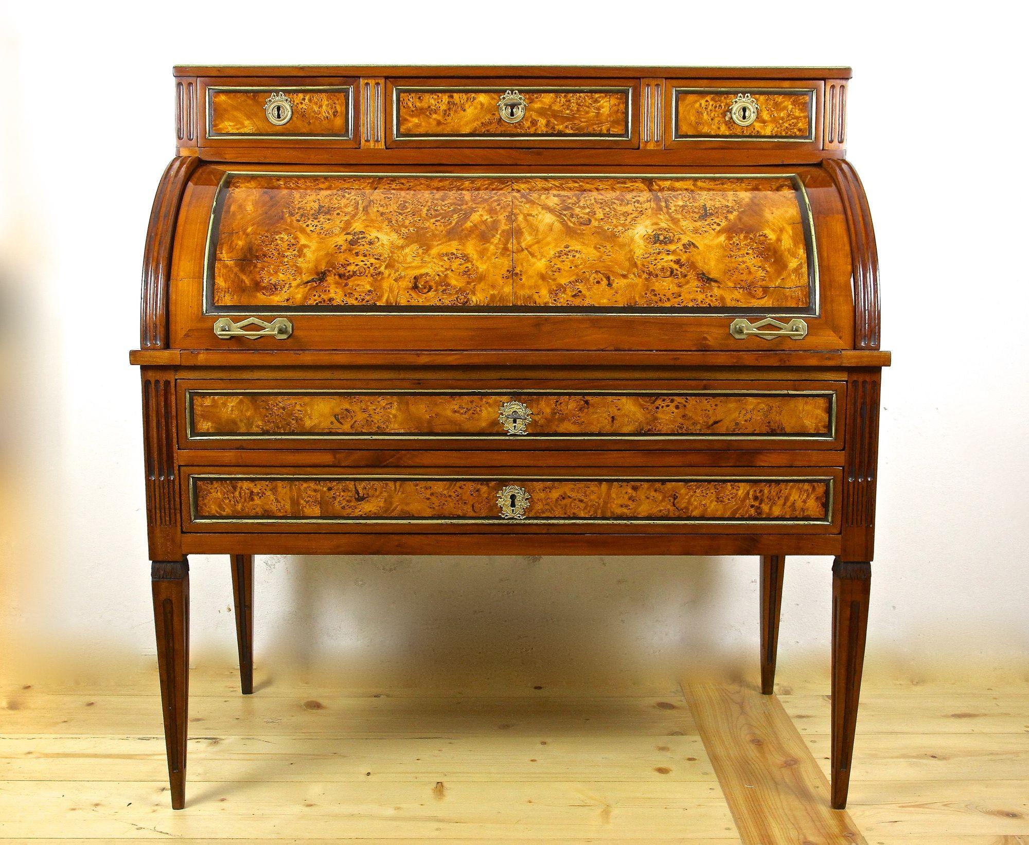 One of a kind, late 18th century French cylinder desk from the period around 1780. Beautifully handcrafted in France, this very special rolltop secretary bureau desk shows a fine cherrywood veneered surface. Fantastic looking fields made of