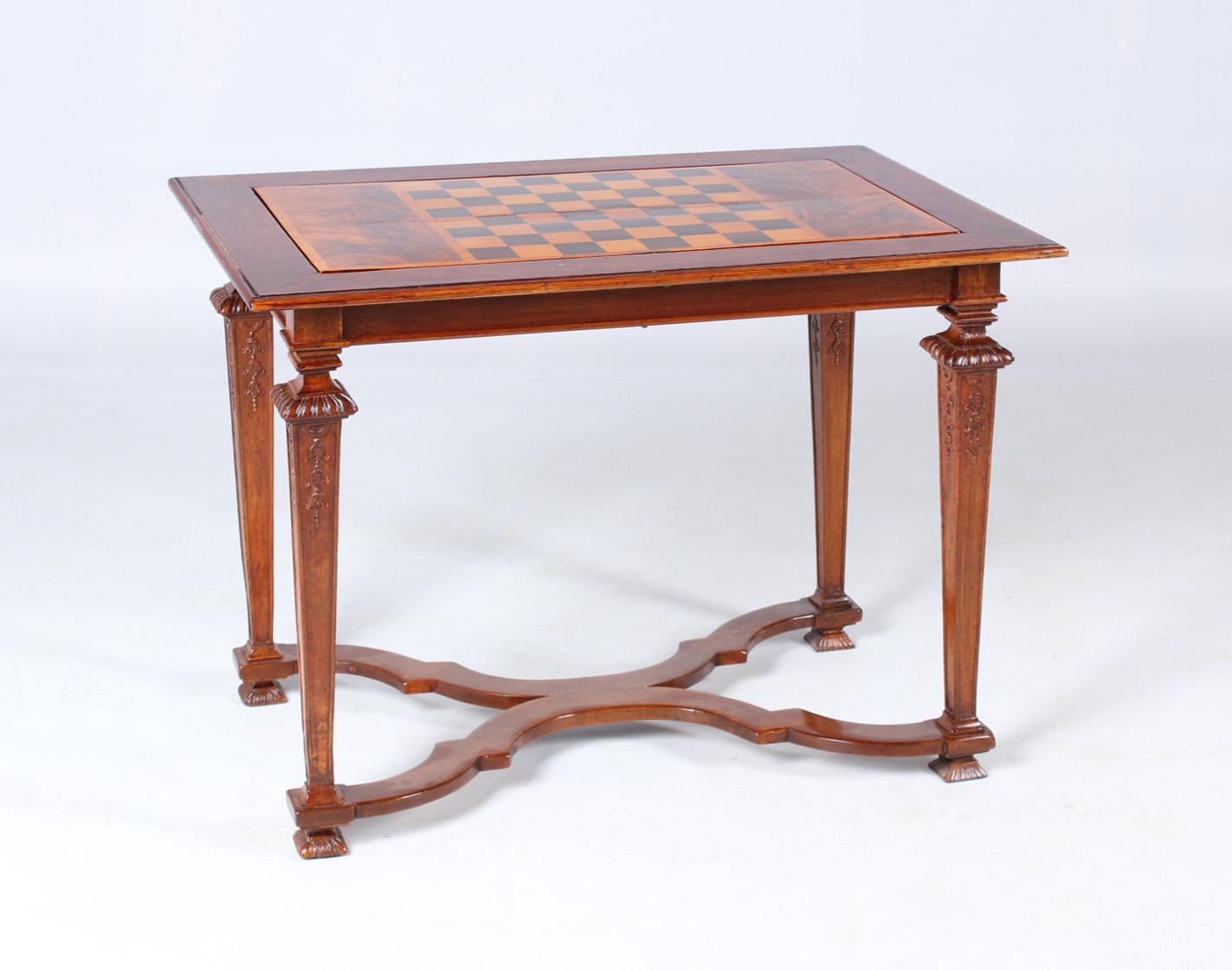 18th century chess and backgammon table

South Germany
Walnut
Louis XVI around 1780

Dimensions: H x W x D: 73 x 99 x 64 cm

Description:
Tapered downward square legs with fine carvings. Cross-shaped curved central bar with thread
