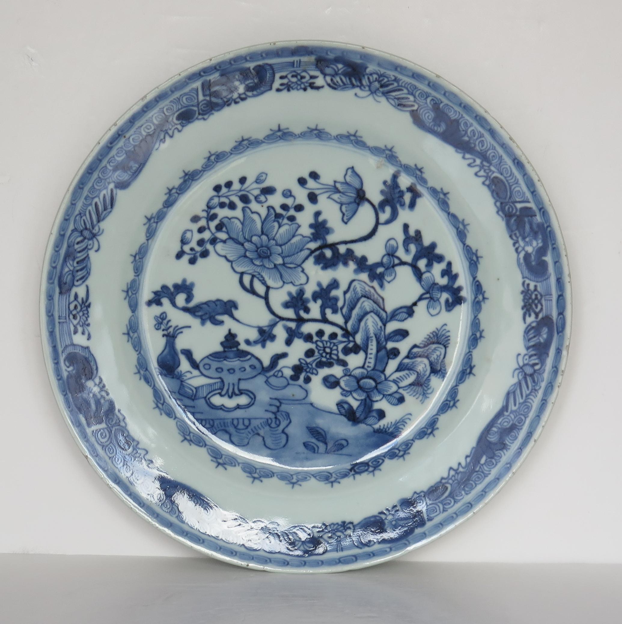This is a very good Chinese porcelain large plate, made for the export (Canton) market, during the middle of the 18th century, Qing-Qianlong period.

The plate is well hand decorated with much detail in varying shades of cobalt blue, with a glaze