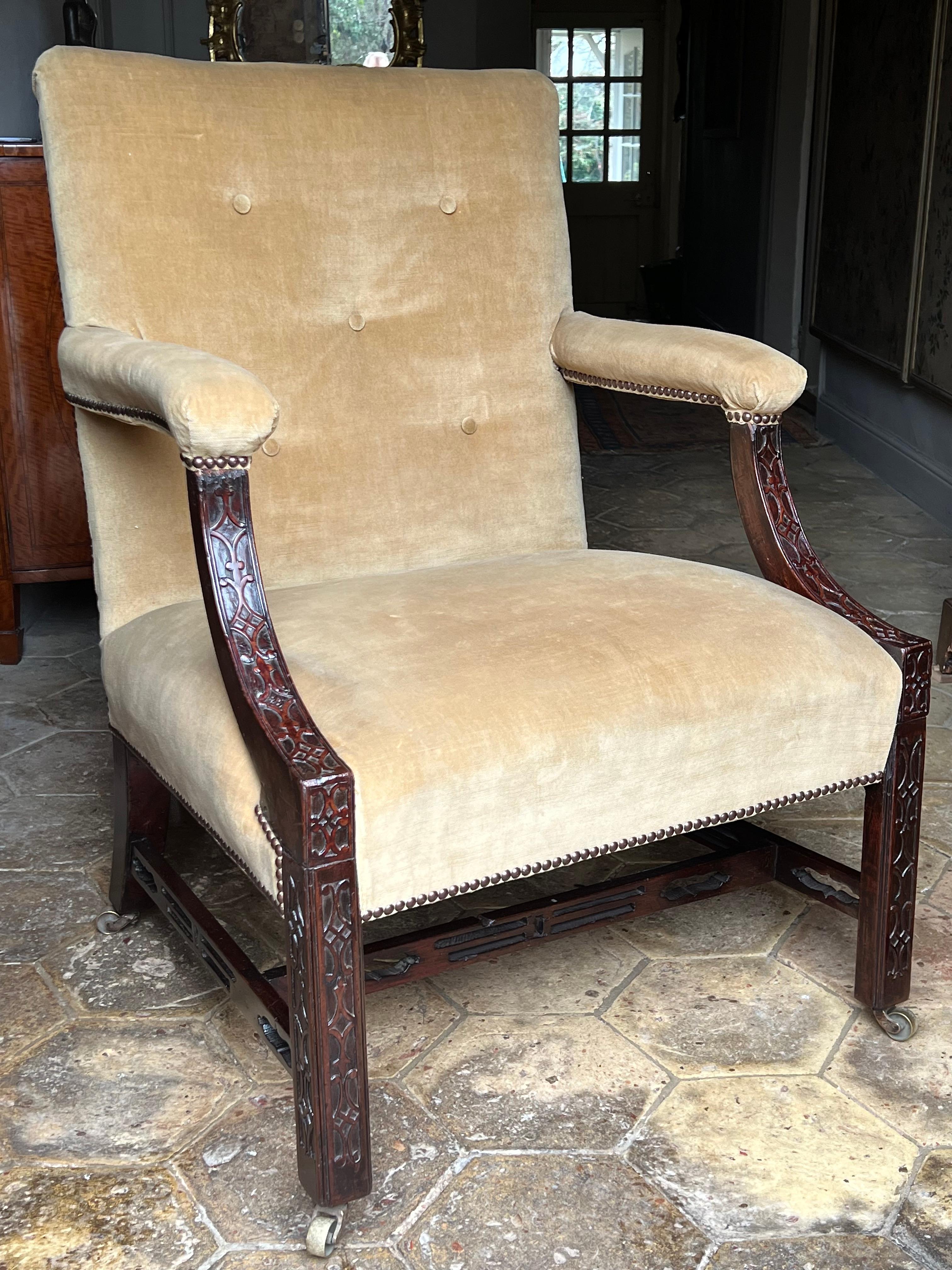 A good Chippendale-period mahogany Gainsborough library armchair, circa 1760.

This is a lovely example of an early-George III Gainsborough armchair in the sophisticated Chinese taste of the period.
With well-executed blind-fret carving to the
