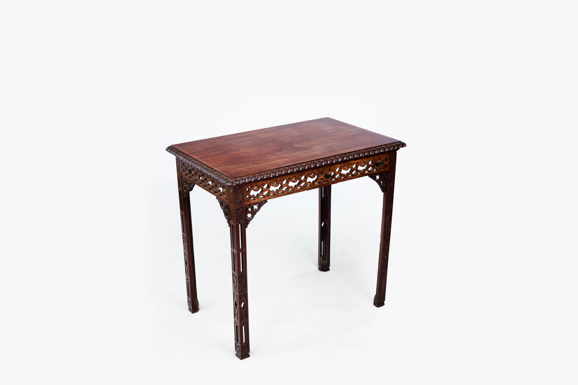 18th Century Chinese Chippendale mahogany silver table with gadrooned moulding to the top edge, open fretwork frieze on all four sides and decorative open fretwork brackets. The piece is raised on four square legs with further Chinese-style applied