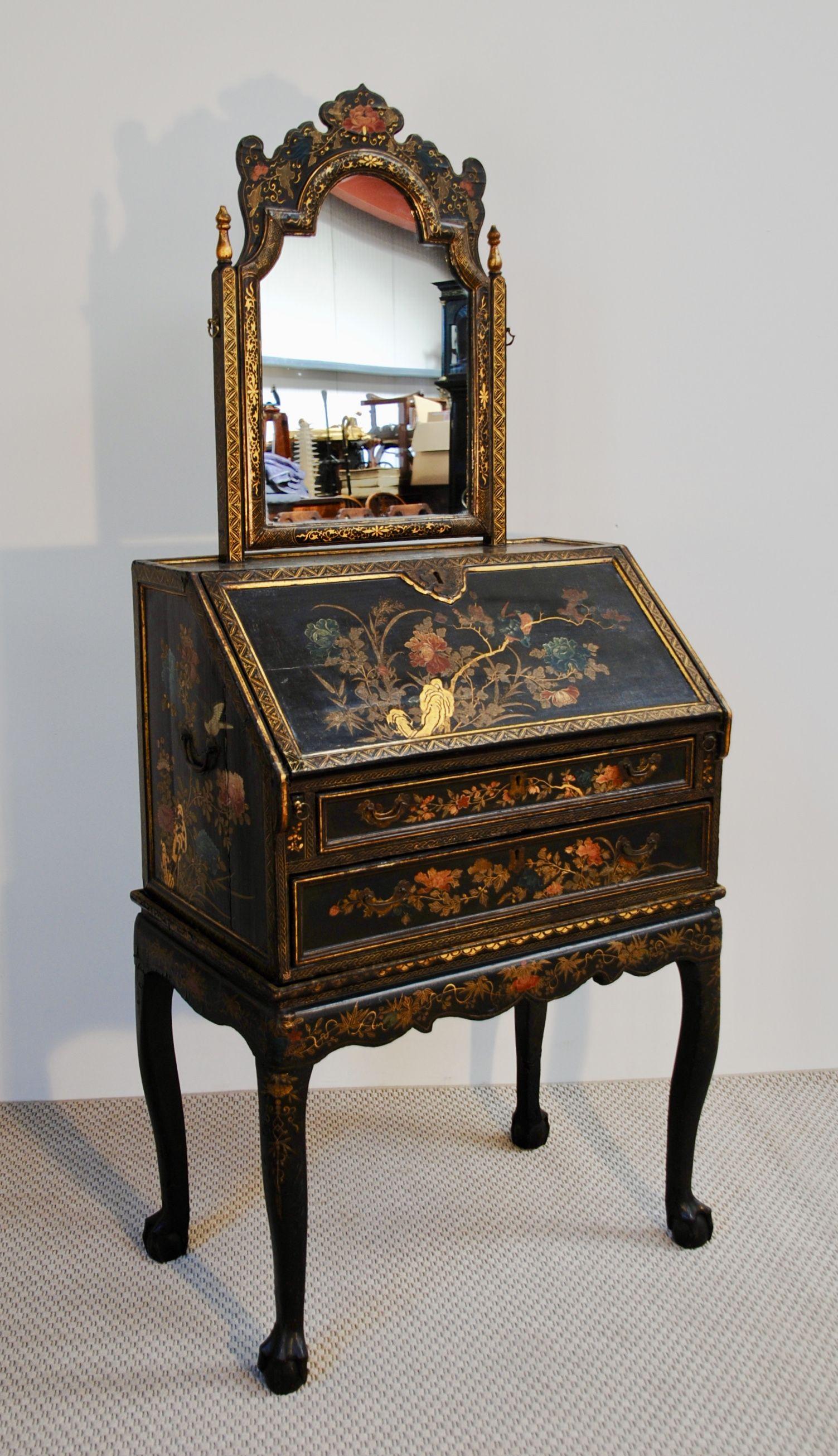 A Chinese export lacquer bureau on stand decorated with an unusual flower design in unrestored country house condition.