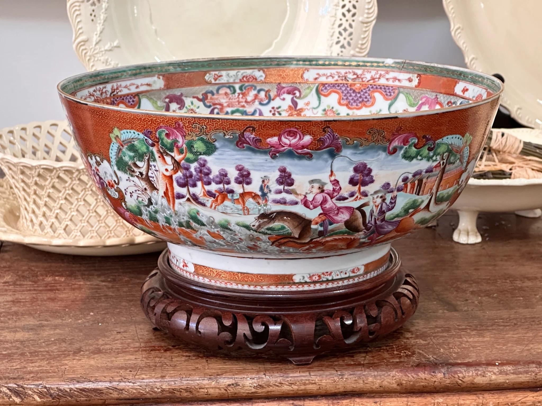 Chinese Export Porcelain Hunt Pattern Punch Bowl.  Late 18th century. Restorations. 4.75” h. x 11.25” diam. 
