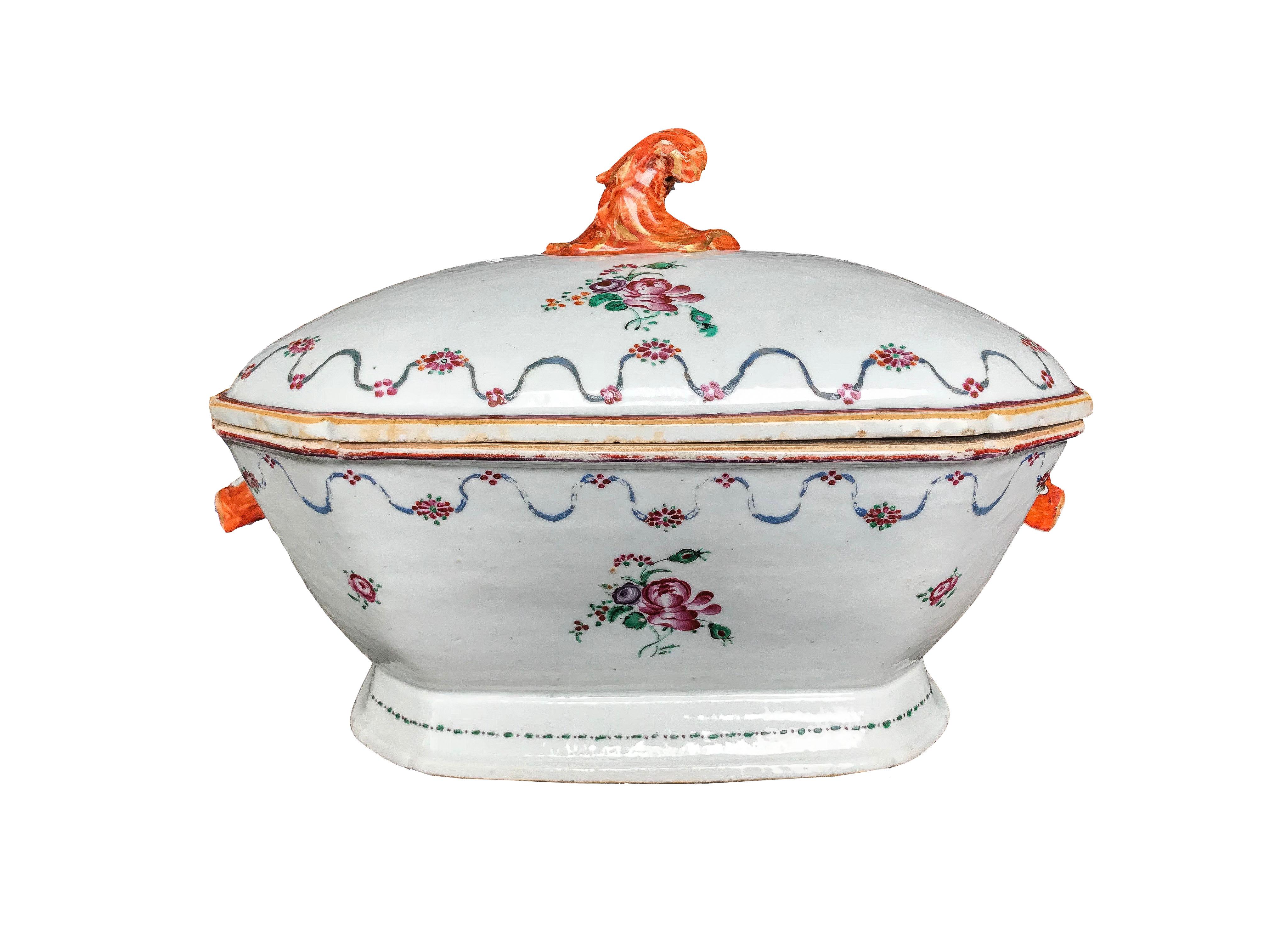 An extraordinary example of the Chinese export porcelain is this tureen with cover and its matching stand, delicately decorated with peonies and vegetable guards motifs. The pig's heads stand out as handles on the sides of the tureen, and knob in