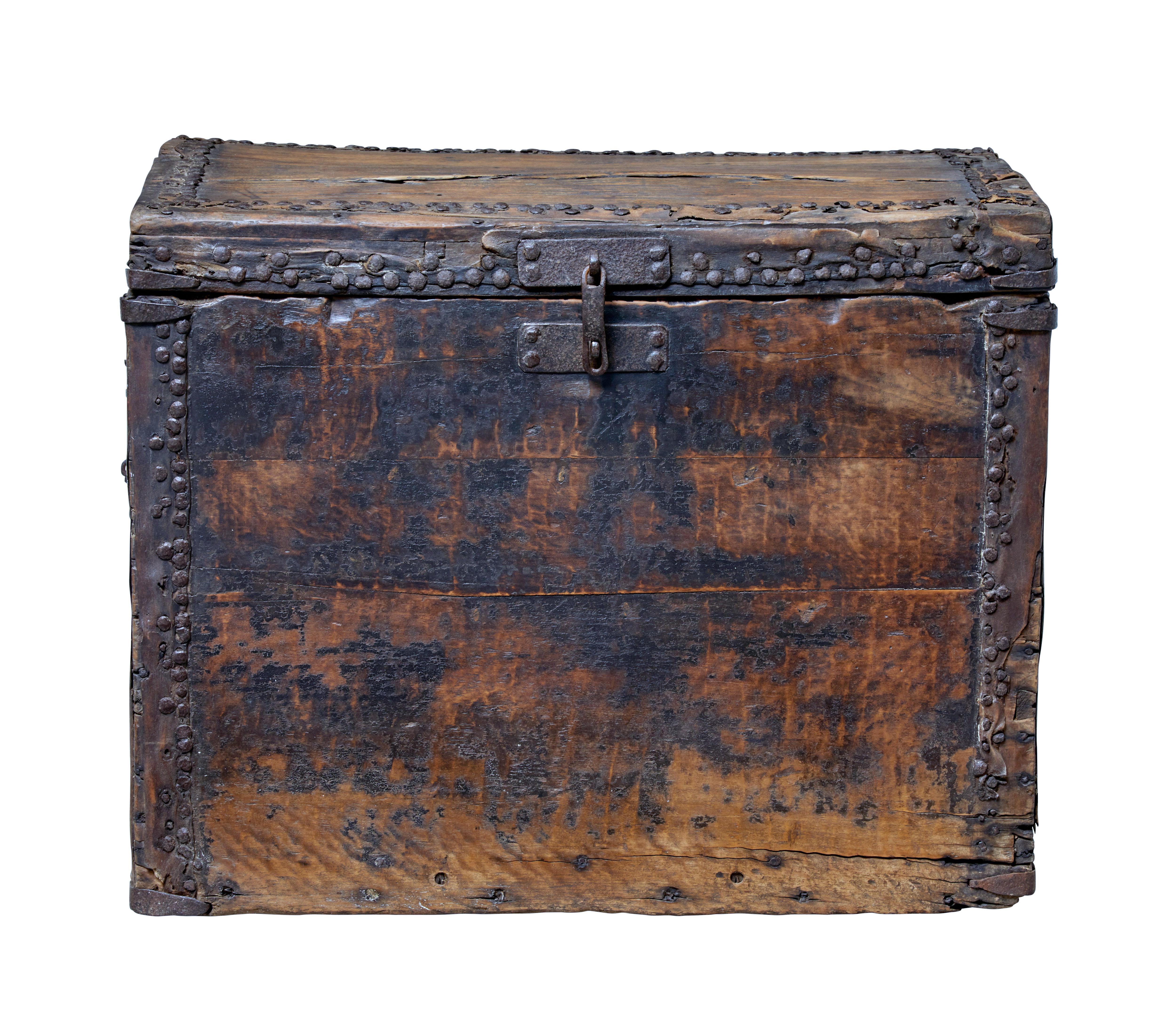 Rare 18th century perhaps earlier hard wood coffer.

Presented in original unrestored condition. Original handles and metal work to outer edges.

Lid opens on ringed handles which are a little vague when closing.

Expected losses and wear.