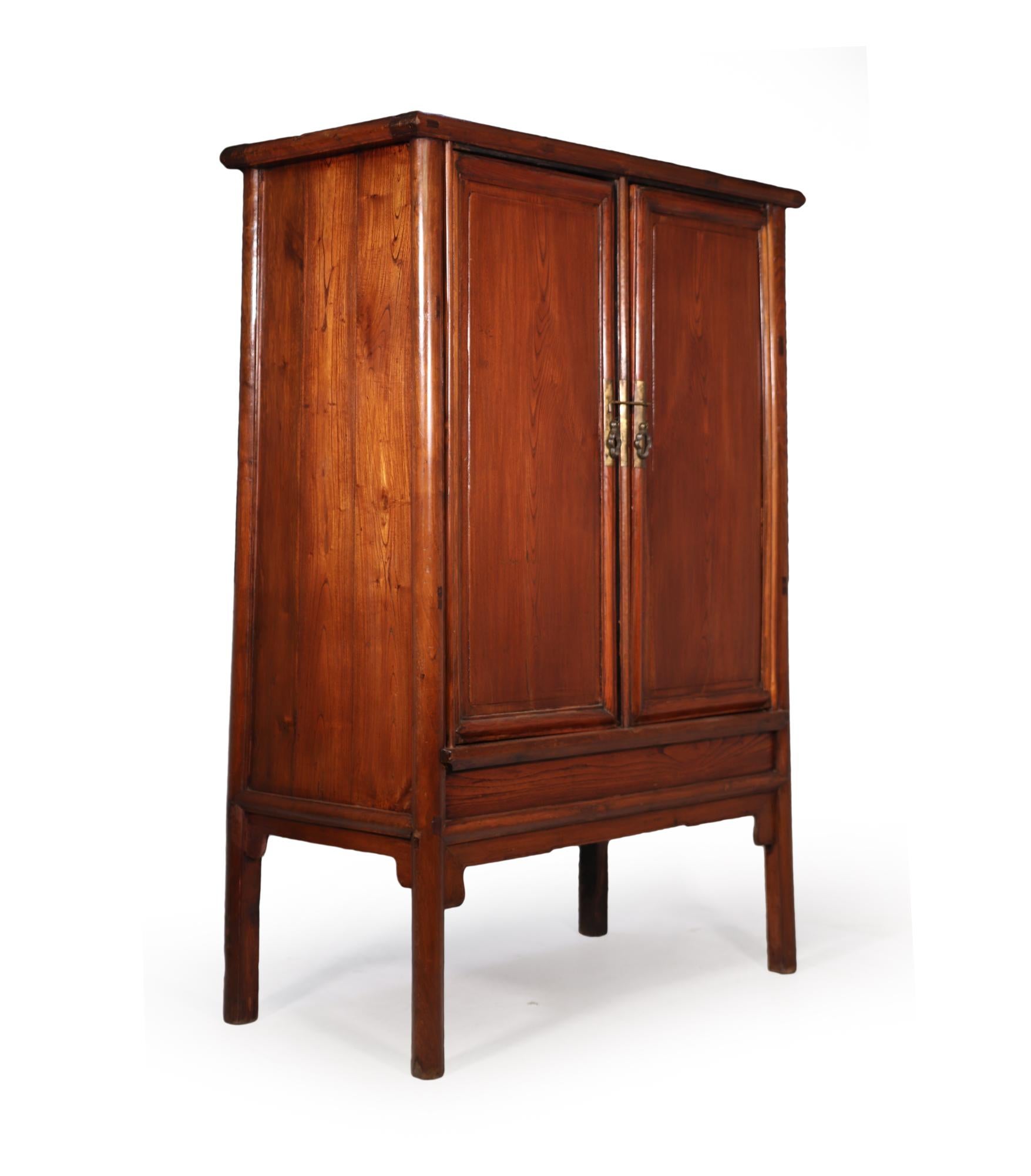 A very simple and plain Chinese round corner and tapered cabinet produced early 18th century from mixed hardwoods, with later restorations and repairs the center drawers inside are not original to this cabinet but can be removed as it is not fixed.