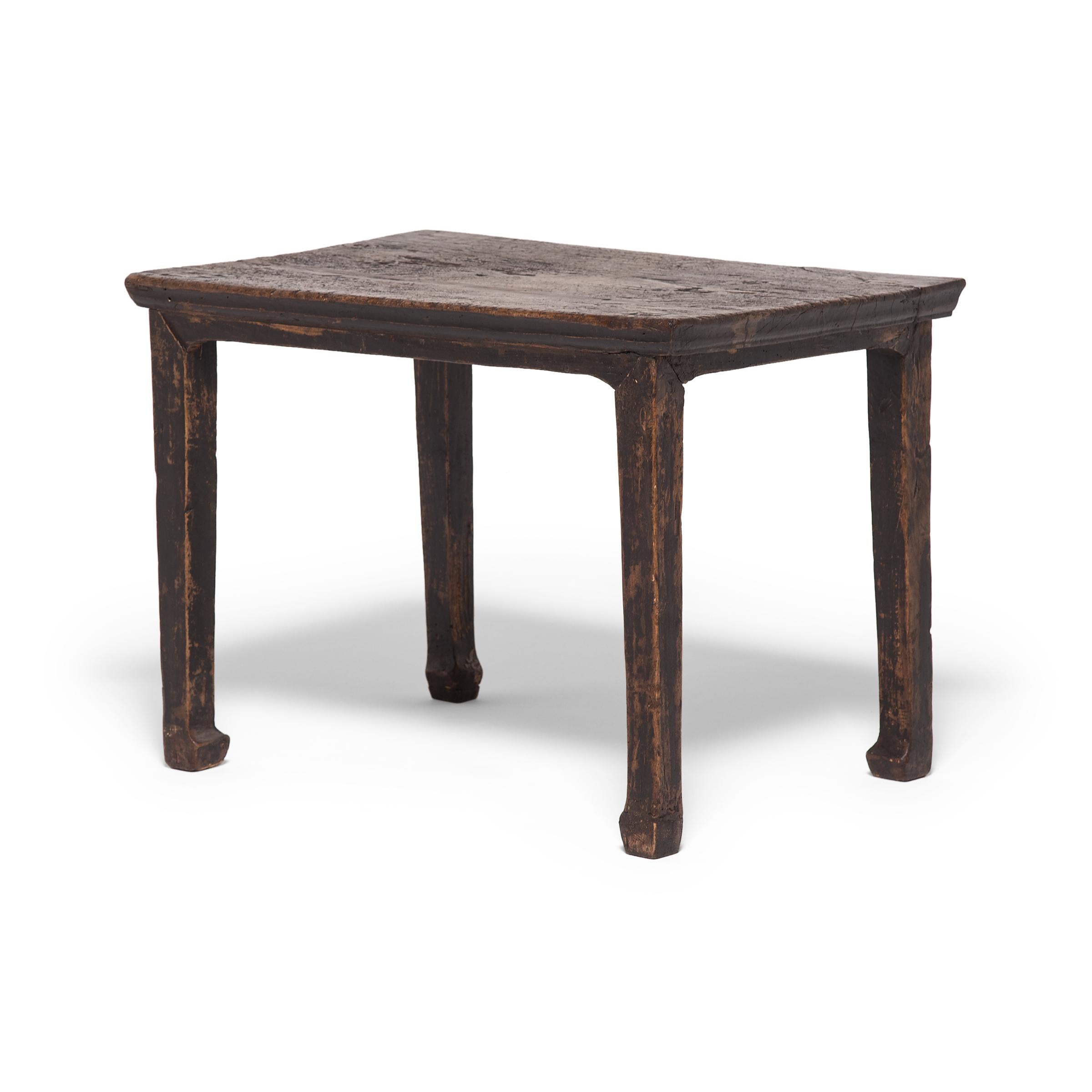 This early Qing-dynasty example of a hoofed foot table exemplifies the way the sophisticated minimalism of the Ming dynasty influenced even provincial furniture. The design is elegantly proportioned with a slim top and square legs ending in hoofed