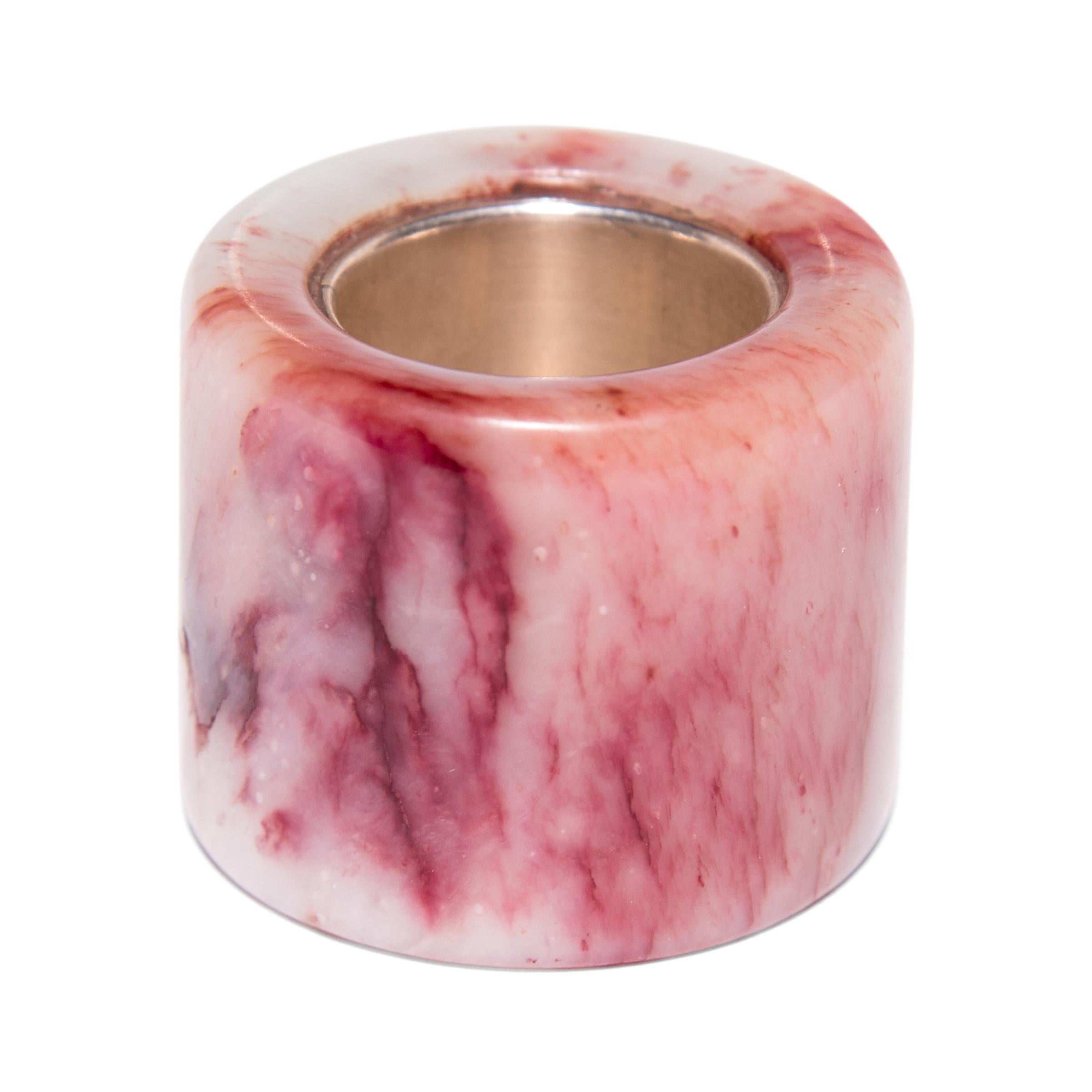 Hand carved of vibrant red jadeite, known as konpi, this 18th century archer's ring was likely once worn by a gentleman-scholar in northern China. Traditionally, Chinese archers wore these rings to protect their thumbs while drawing a bowstring.