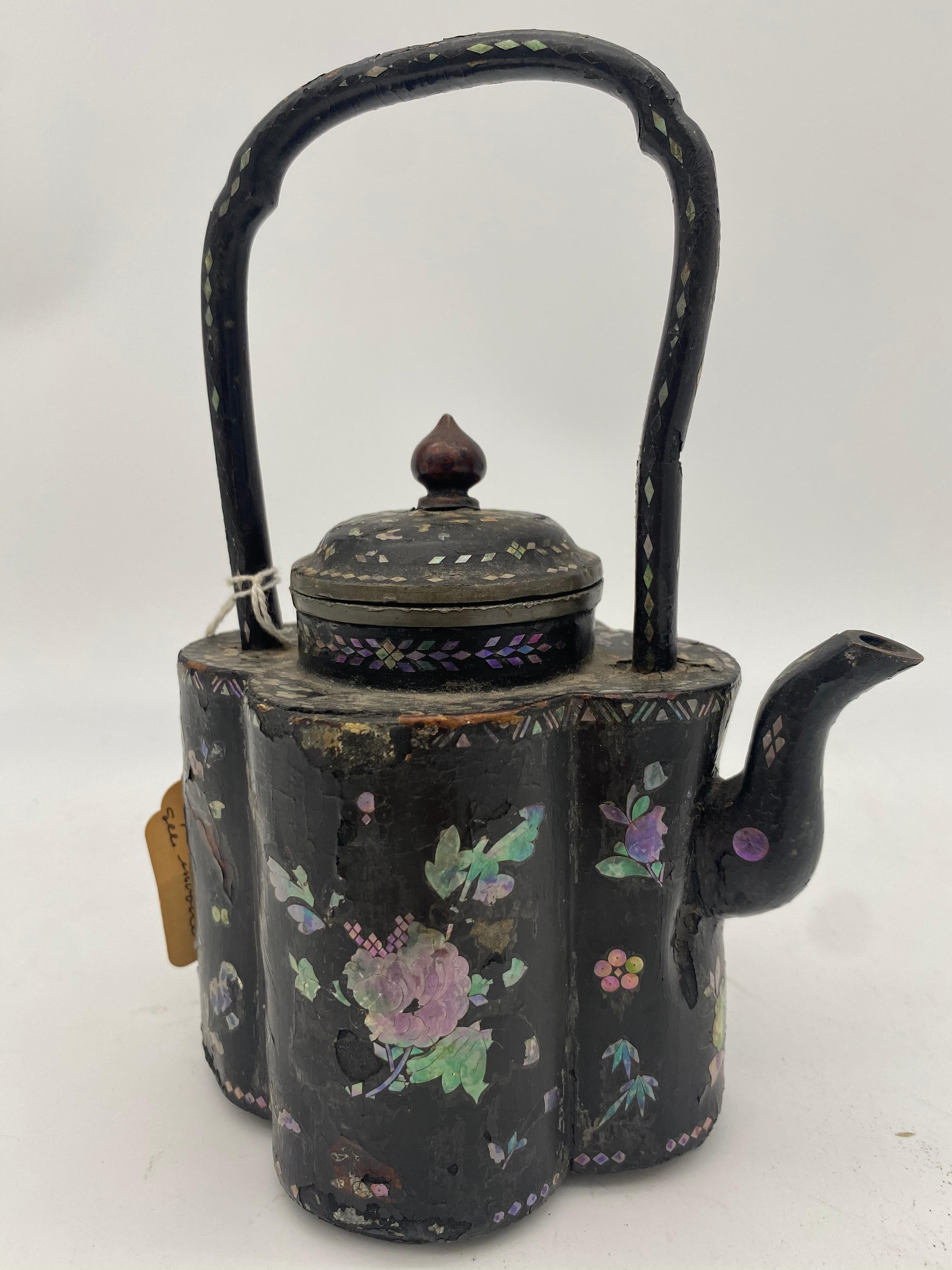 18th century Chinese lacquer mother of pearl inlay pewter teapot, height to handle top 8 inch, floral decoration as expected for age and use. Very beautiful and hard to find like this.