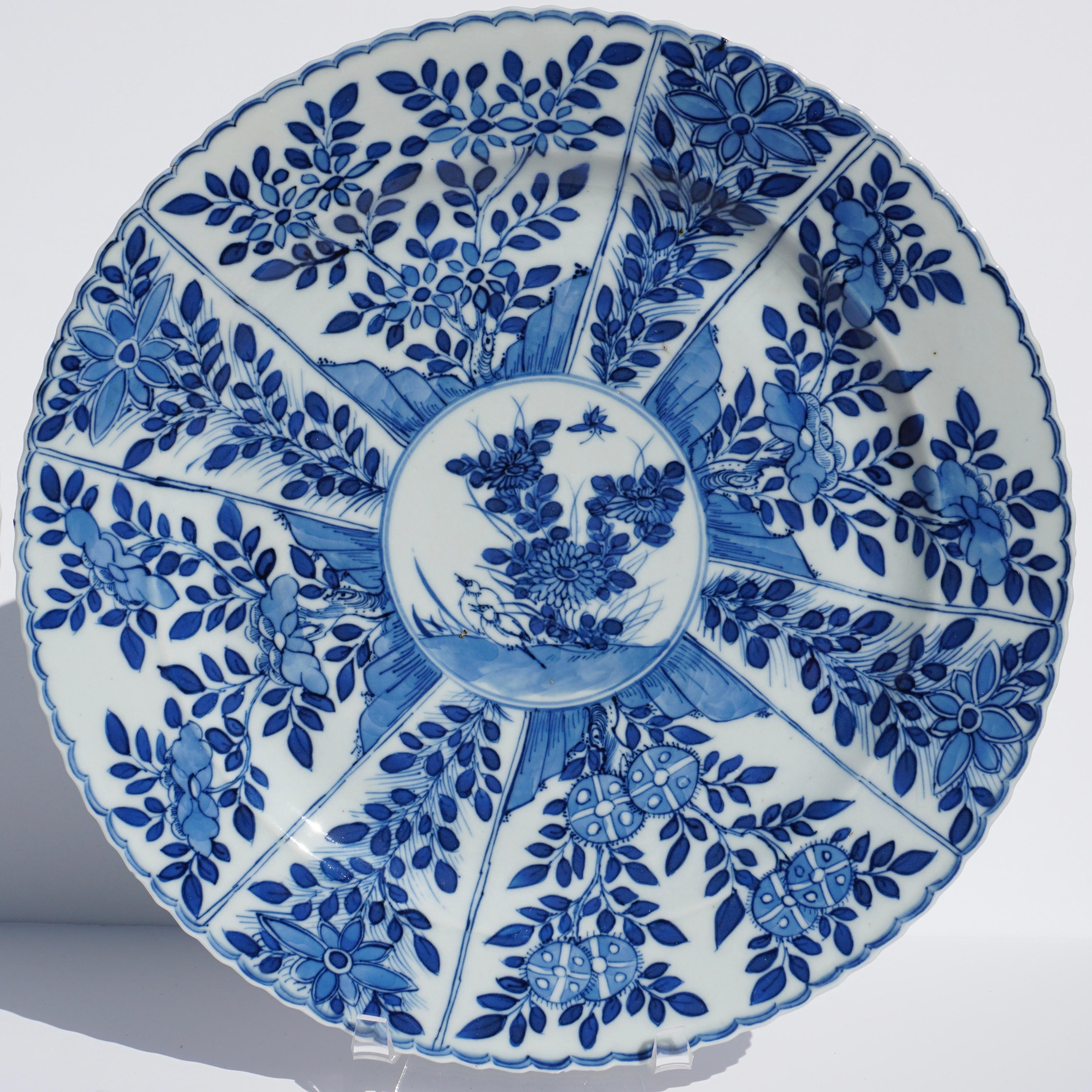 Here is a set of beautiful blue and white hand painted Chinese porcelain plates dating to the last half of the 18th century, circa 1780, Qing dynasty. The plates are beautifully potted, and have been hand decorated in a lovely free flowing manner in