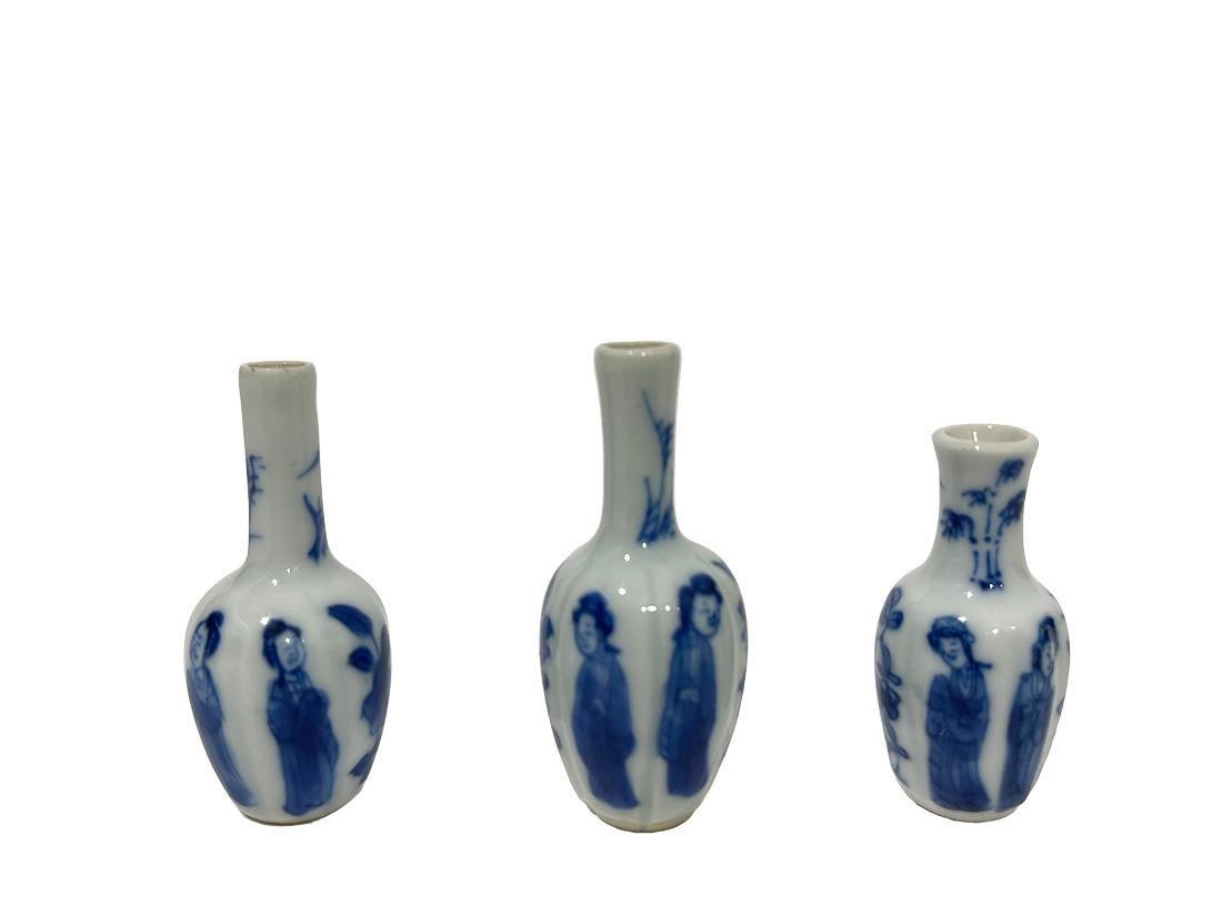 18th Century Chinese Porcelain Dollhouse Miniatures Blue and White Kangxi Vases 

Three miniature Chinese porcelain dollhouse vases. Chinese porcelain made during the Kangxi period 1662-1722. The porcelain made with oval in panels body with long