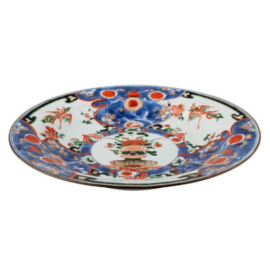 An 18th century Chinese Qing Kangxi porcelain imari pattern plate.

The plate is decorated front and back with blue and orange birds, butterflies and a blood red rim.

The plate is in good original condition with a minor nick to the base. (Circa