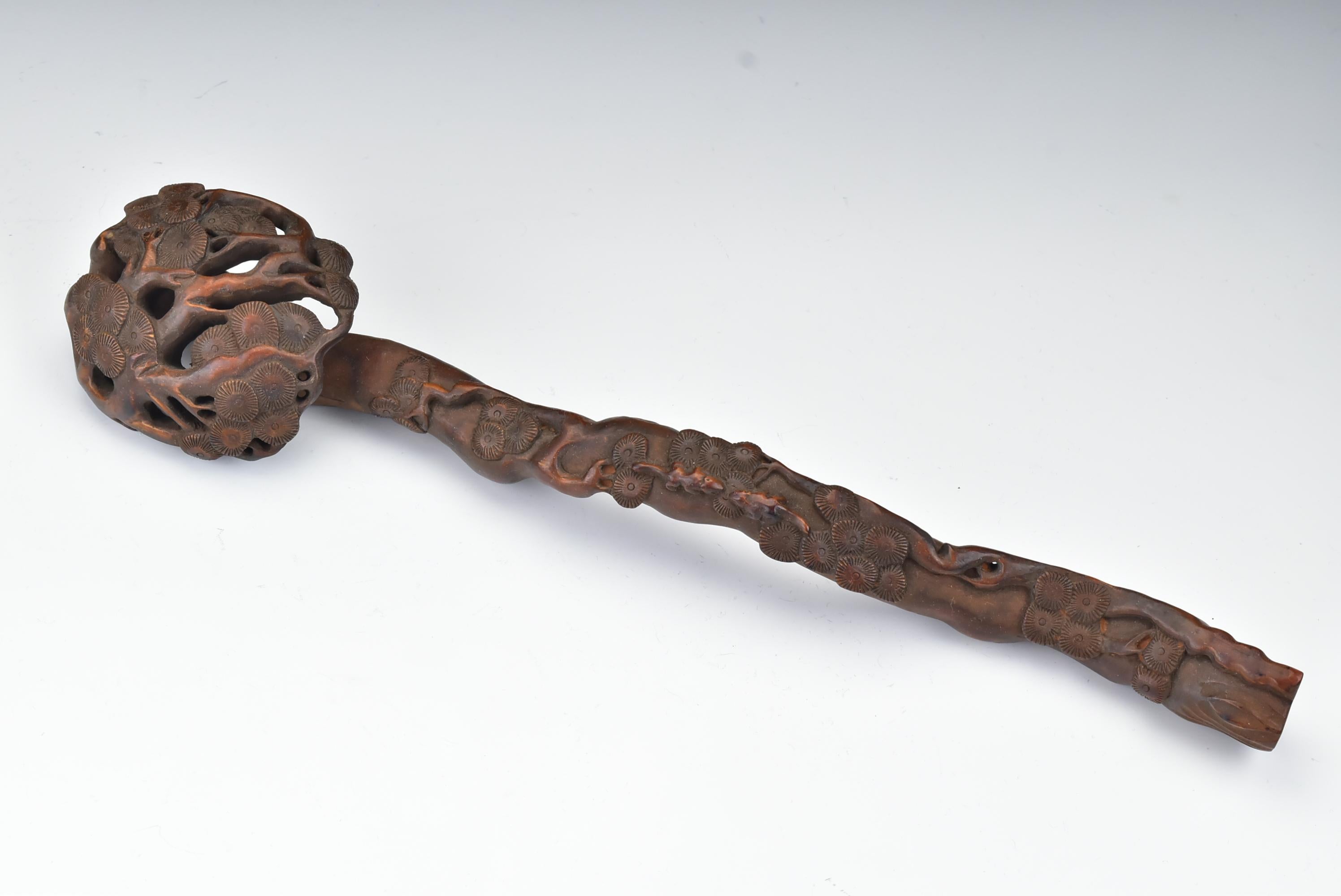 Carved Chinese ruyi scepter with a pine tree and two rats.

Age: circa 1775-1799.

Size: Approximately 14 + 5/8 inches long and 3 inches at it's widest point

Condition: Age appropriate, some natural age splits, see photos for complete