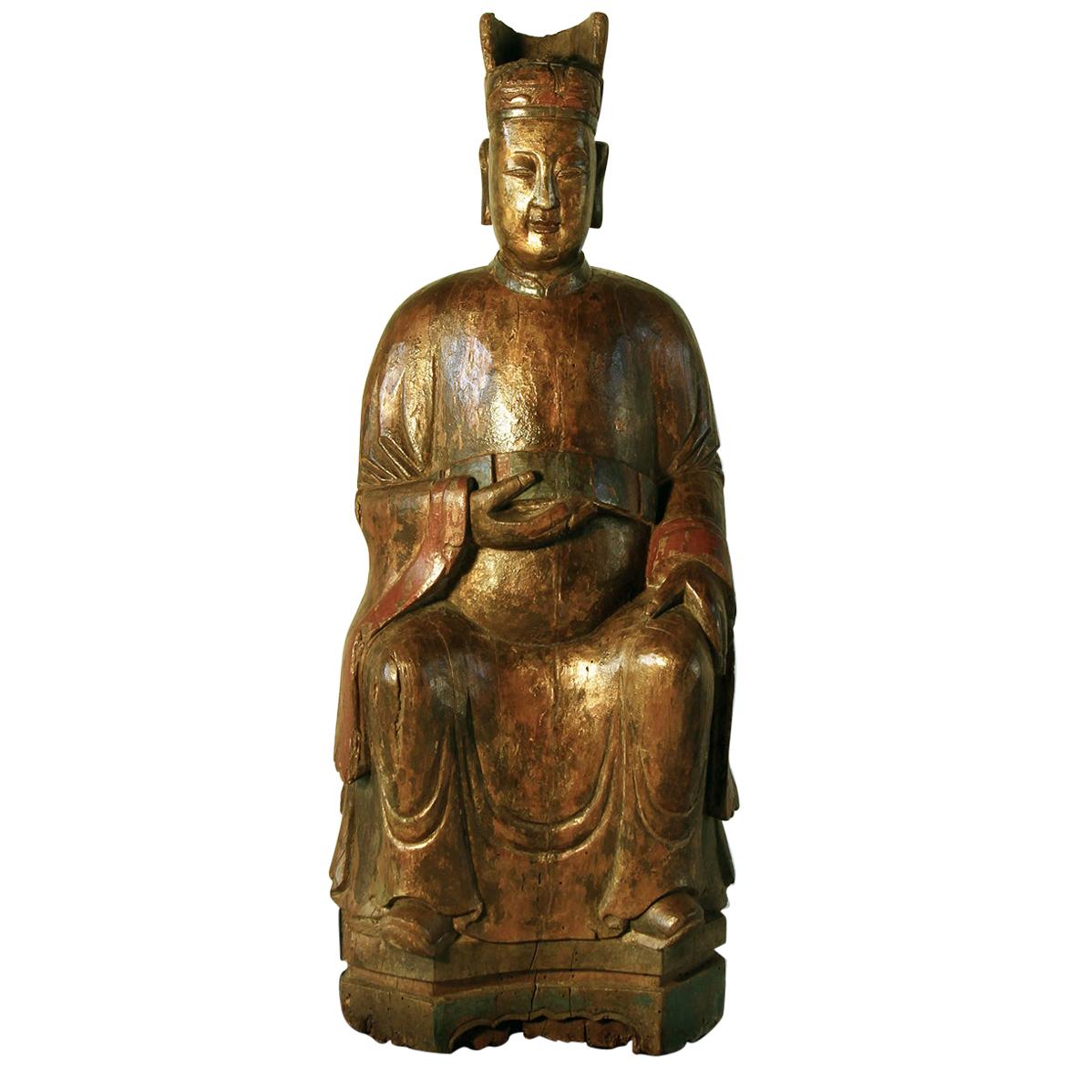 Sculpture chinoise du 18ème siècle d'un dignitaire en bois dur sculpté et laqué