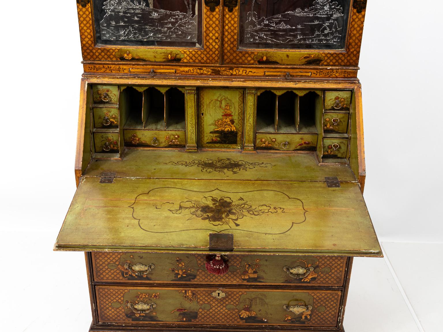 Chinoiserie style slant front desk with two parts and fitted interior, circa 18th century. The piece also features mirrored front with landscape scenes. Please note of wear consistent with antique age.