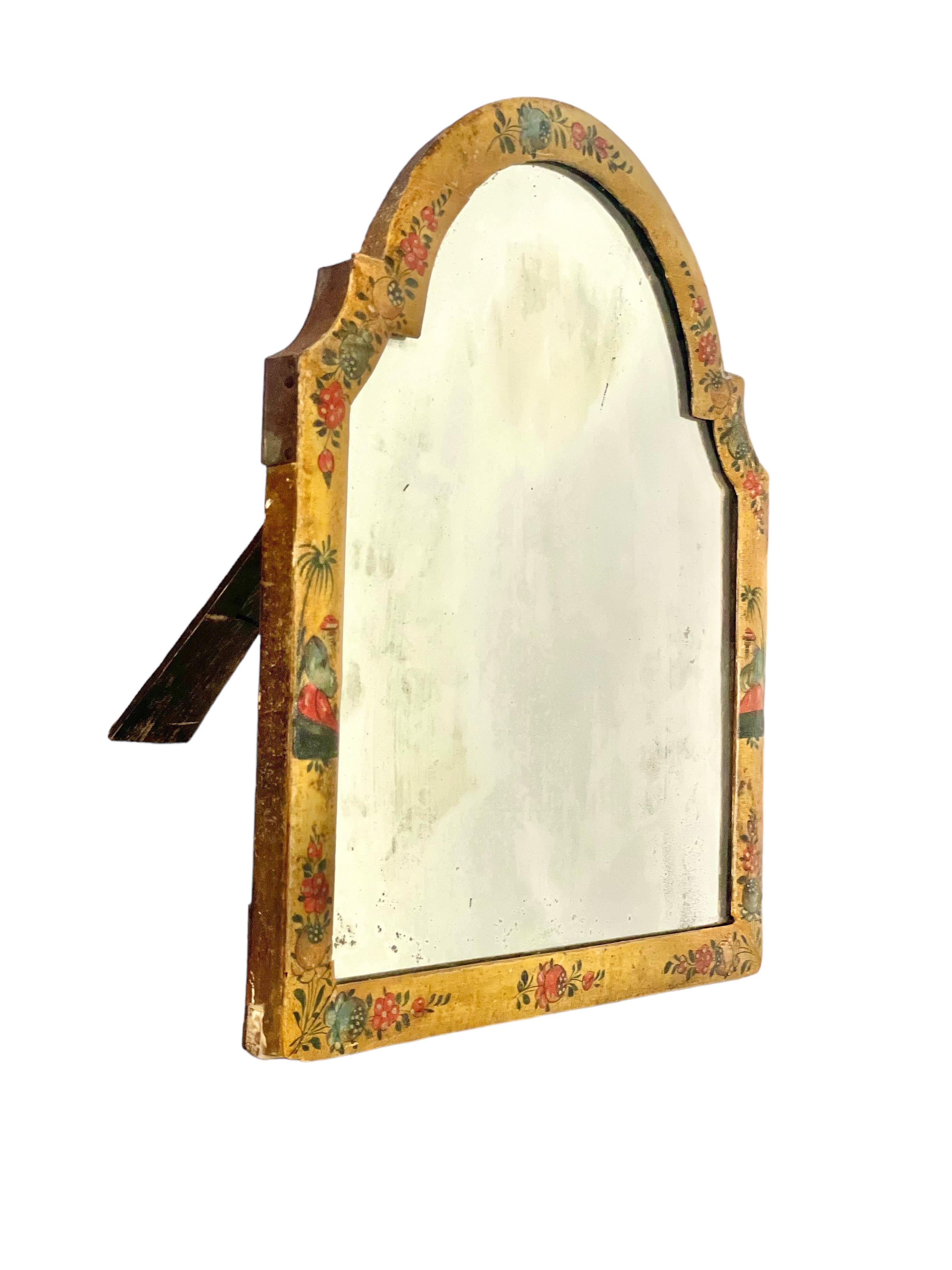 This unusual table-top 'Psyche' table mirror dates from the 18th century, its wooden frame beautifully crafted from yellow-lacquered wood and decorated with hand-painted chinoiserie motifs all round. Mounted on a pivoted frame, which can be tilted