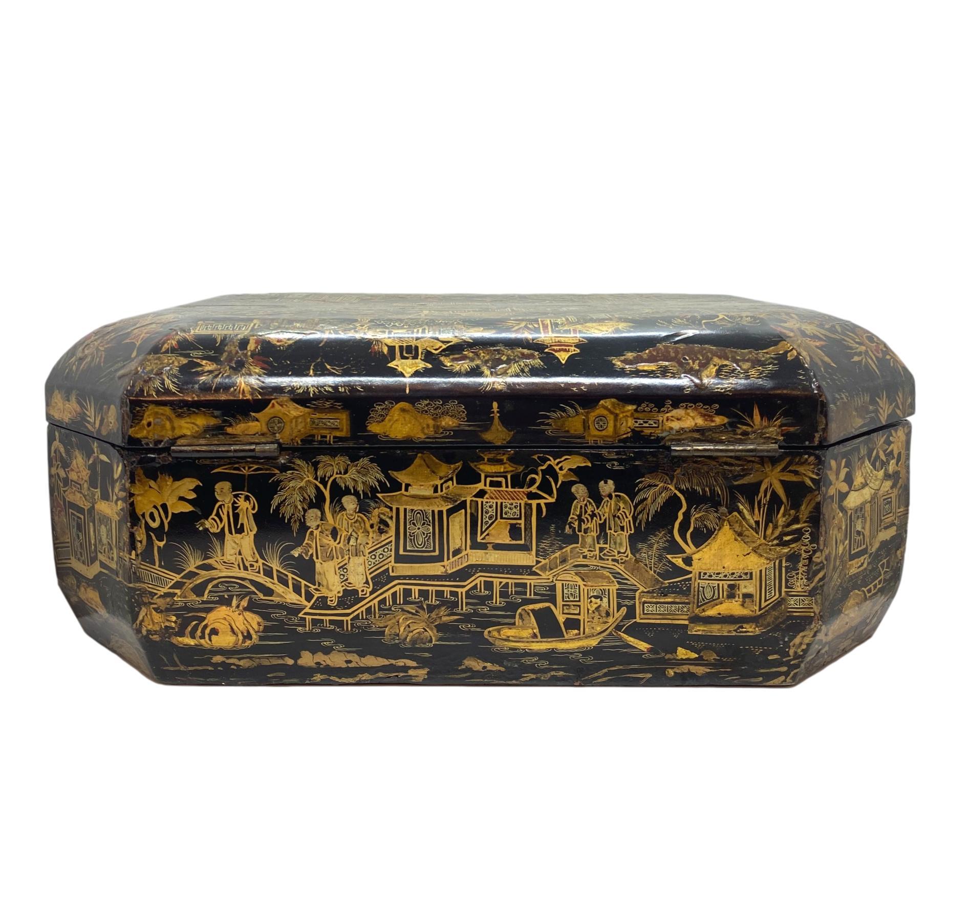 Chinese Export Style black-lacquer and gilt-chinoiserie decorated workbox with cinnabar highlights, of canted rectangular form with hinged lid enclosing fitted interior, with a fitted drawer, fourth-quarter 18th century.