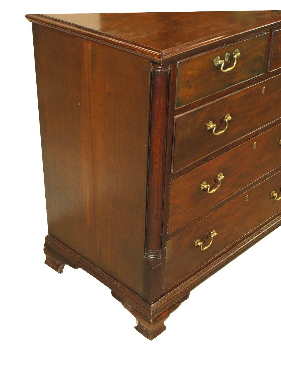 18th century Chippendale chest, the top has beautiful grain( minor ink stains, see photo) , the two over three graduated drawers retain their original swan neck handles, secondary wood is oak. The front corners feature an inset convex quarter column