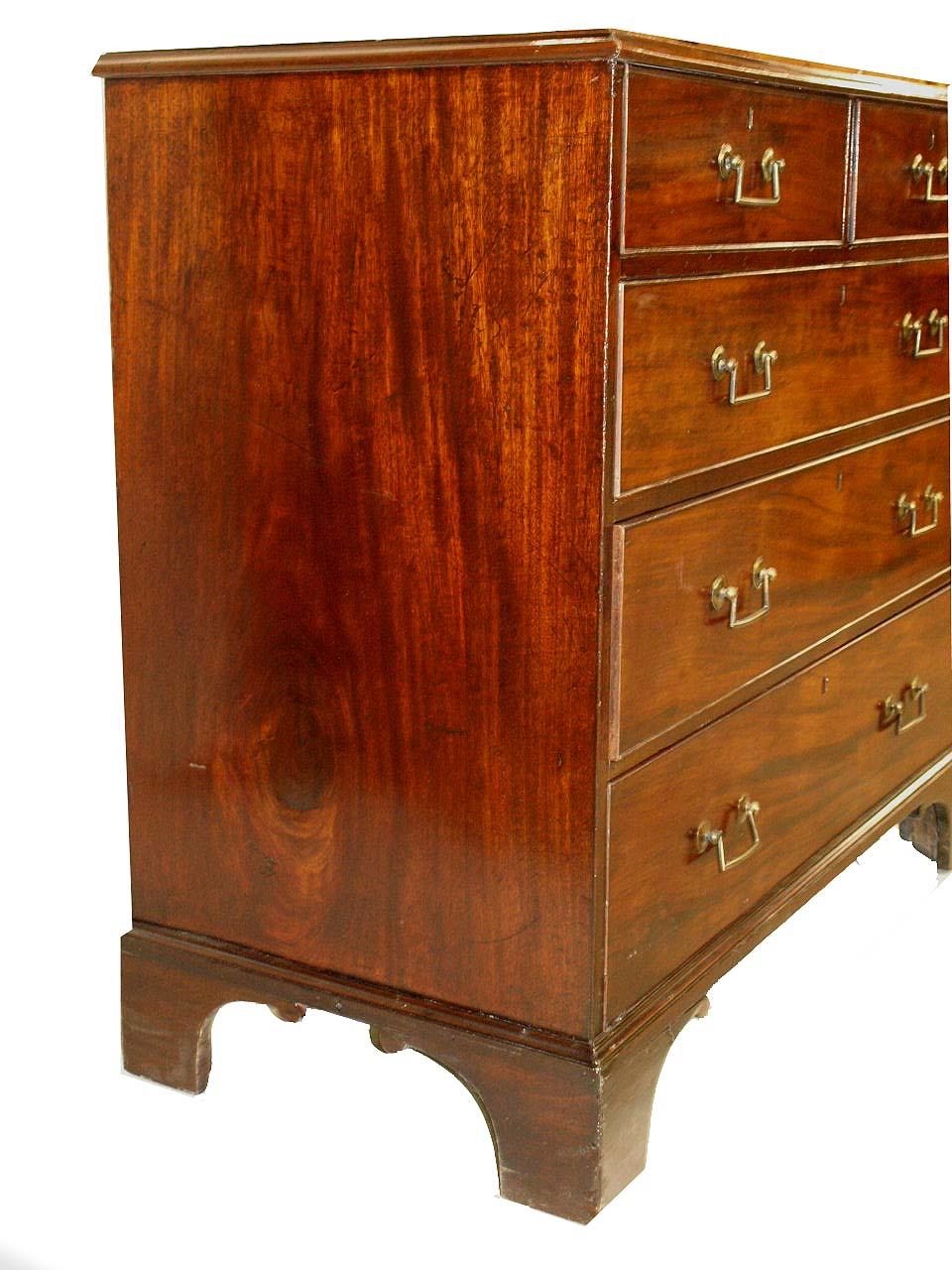 18th Century Chippendale mahoagany chest of drawers; this two over three drawer chest has an absolutely beautiful figured mahogany top , the original brass bail handles are unusual with being squared off ( not the usual swan neck design) . This