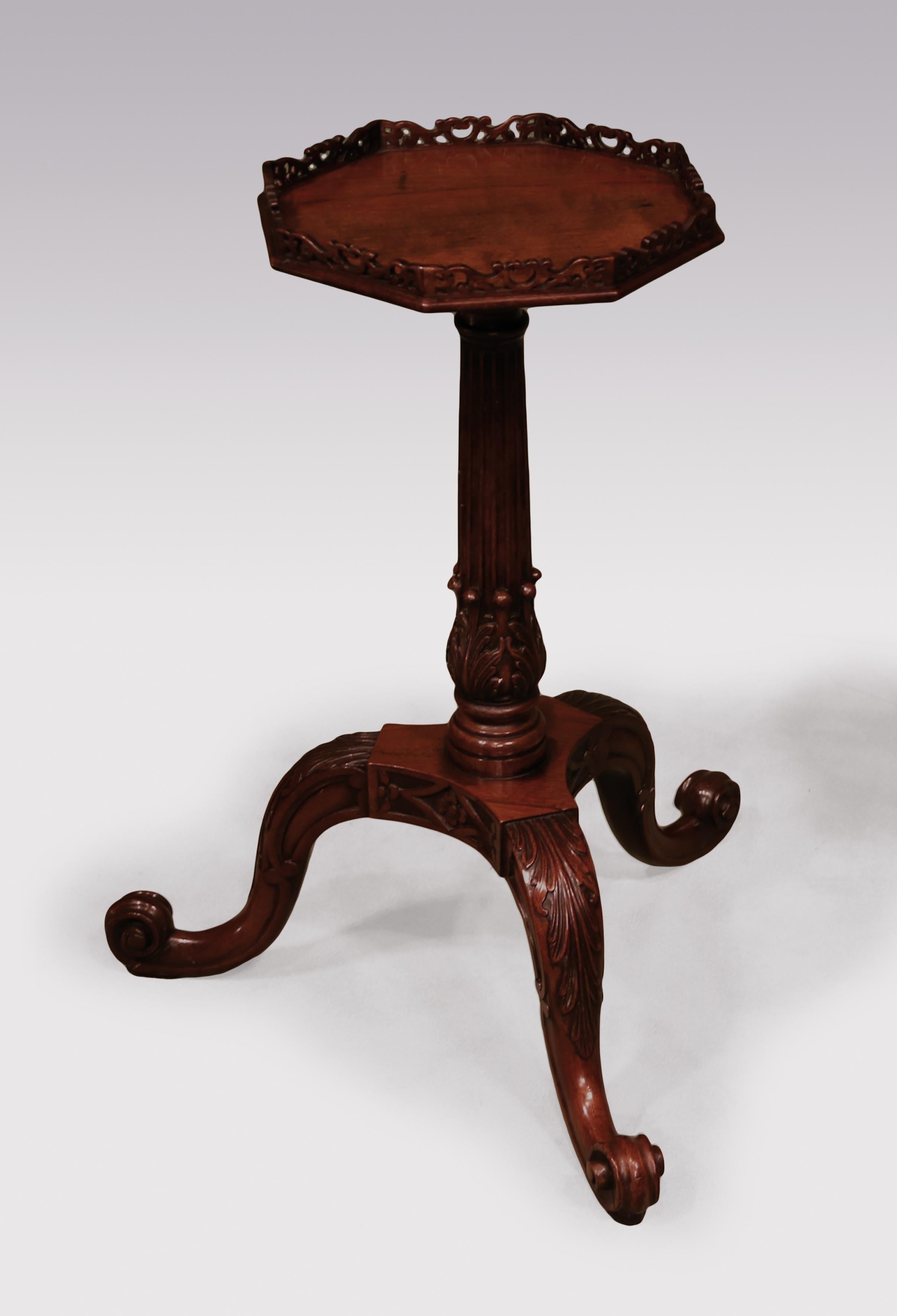 A fine mid-18th century Chippendale period mahogany kettle stand, having pierced galleried octagonal top, raised on acanthus carved fluted stem ending on acanthus carved scrolled tripod legs.