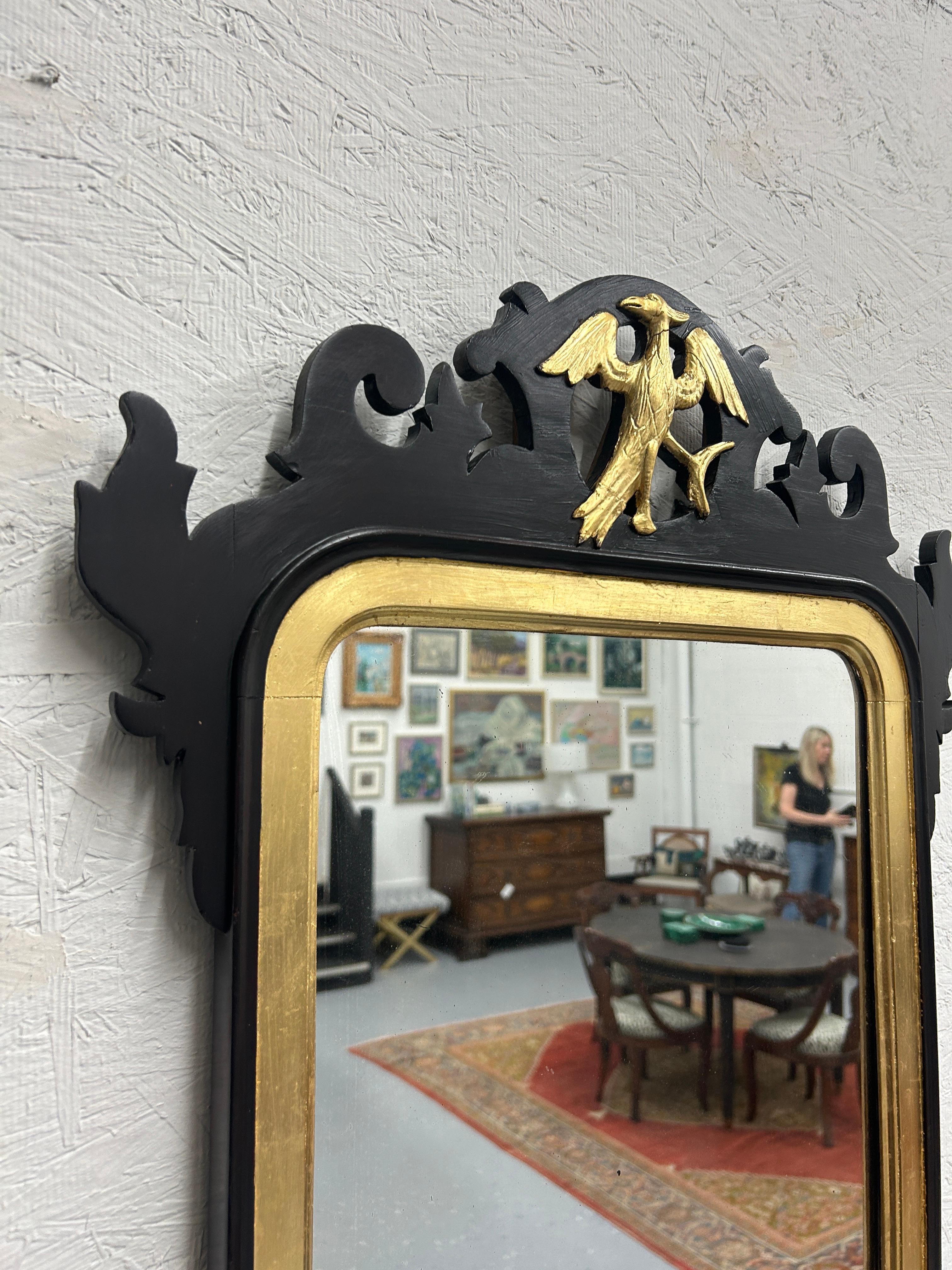 ntroducing our iconic 18th Century Chippendale Style Wall Mirror, a true masterpiece that embodies the essence of timeless elegance and craftsmanship. Measuring an impressive 20.75