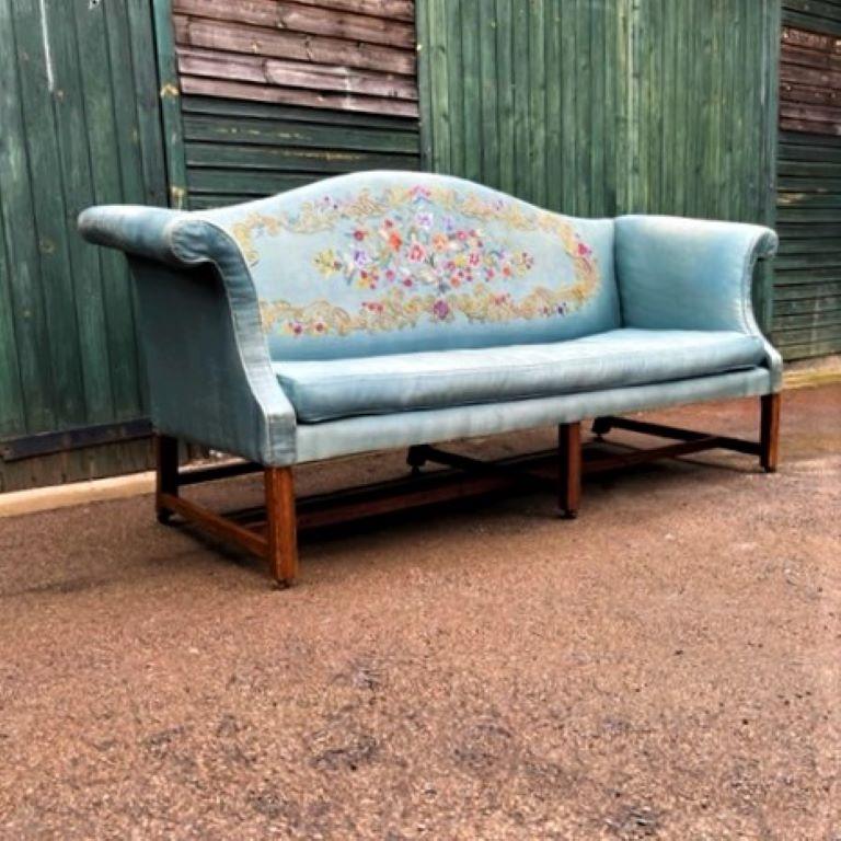 18th century Chippendale-period mahogany camel back sofa standing on mahogany moulded front legs with barrel castors, almost certainly Scottish.

 