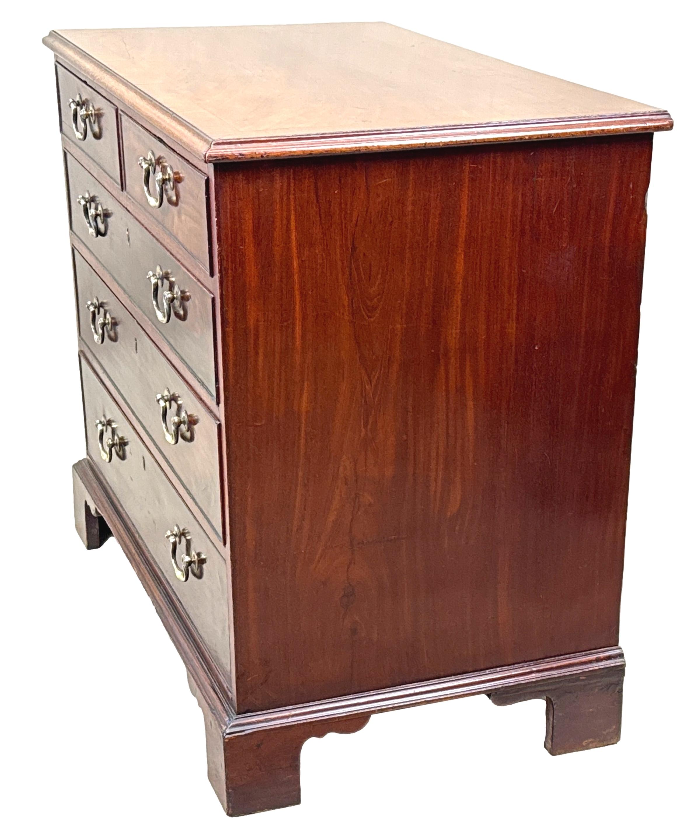 A Very Good Quality 18th Century, Georgian, Chippendale Period, Mahogany Chest, Having Very Well Figured Top With Attractive Crossbanded Decoration, Over Two Short And Three Long Drawers, Retaining Original Brass Swan Neck Handles, Raised On Elegant