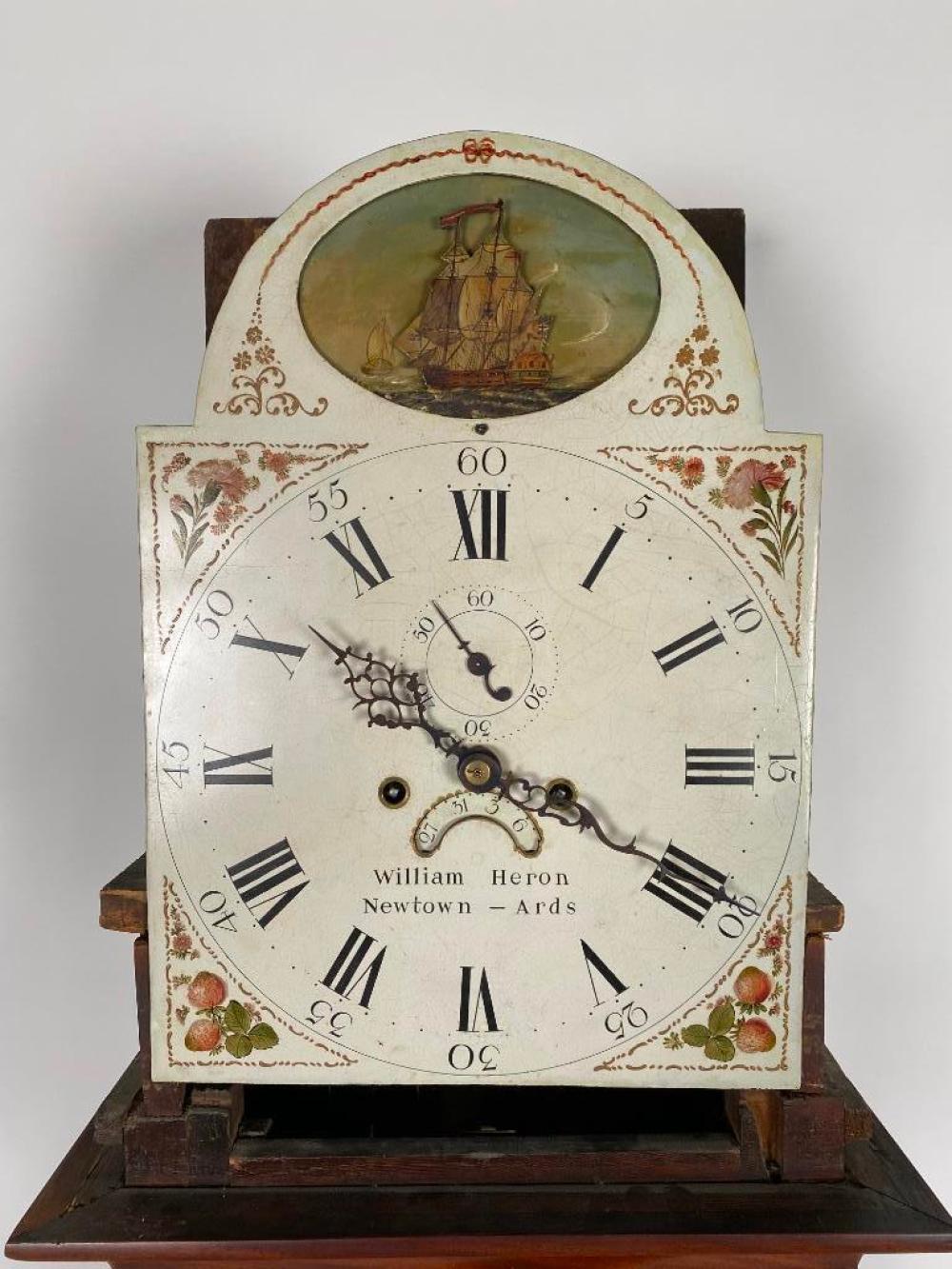 IRISH TALL-CASE CLOCK BY WILLIAM HERON 
Late 18th Century 
Mahogany case, the bonnet with a scrolled broken arch pediment and the trunk with quarter columns. Rocking ship movement in lunette. Dial marked 