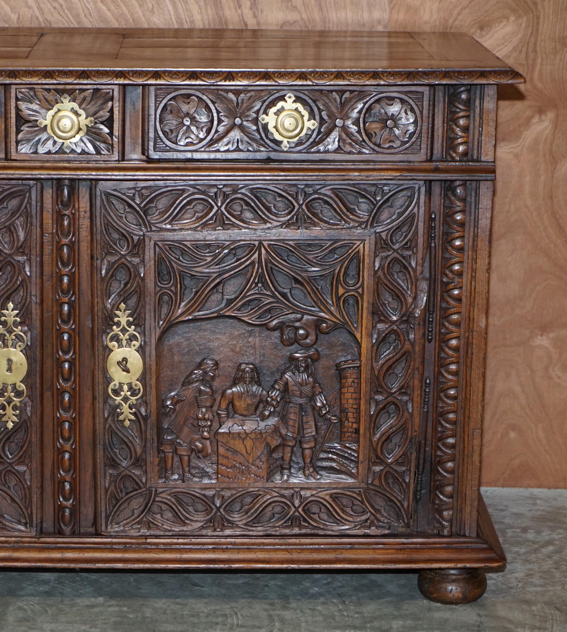 European 18th Century Circa 1740 Hand Carved Oak Sideboard with Military Campaign Scenes