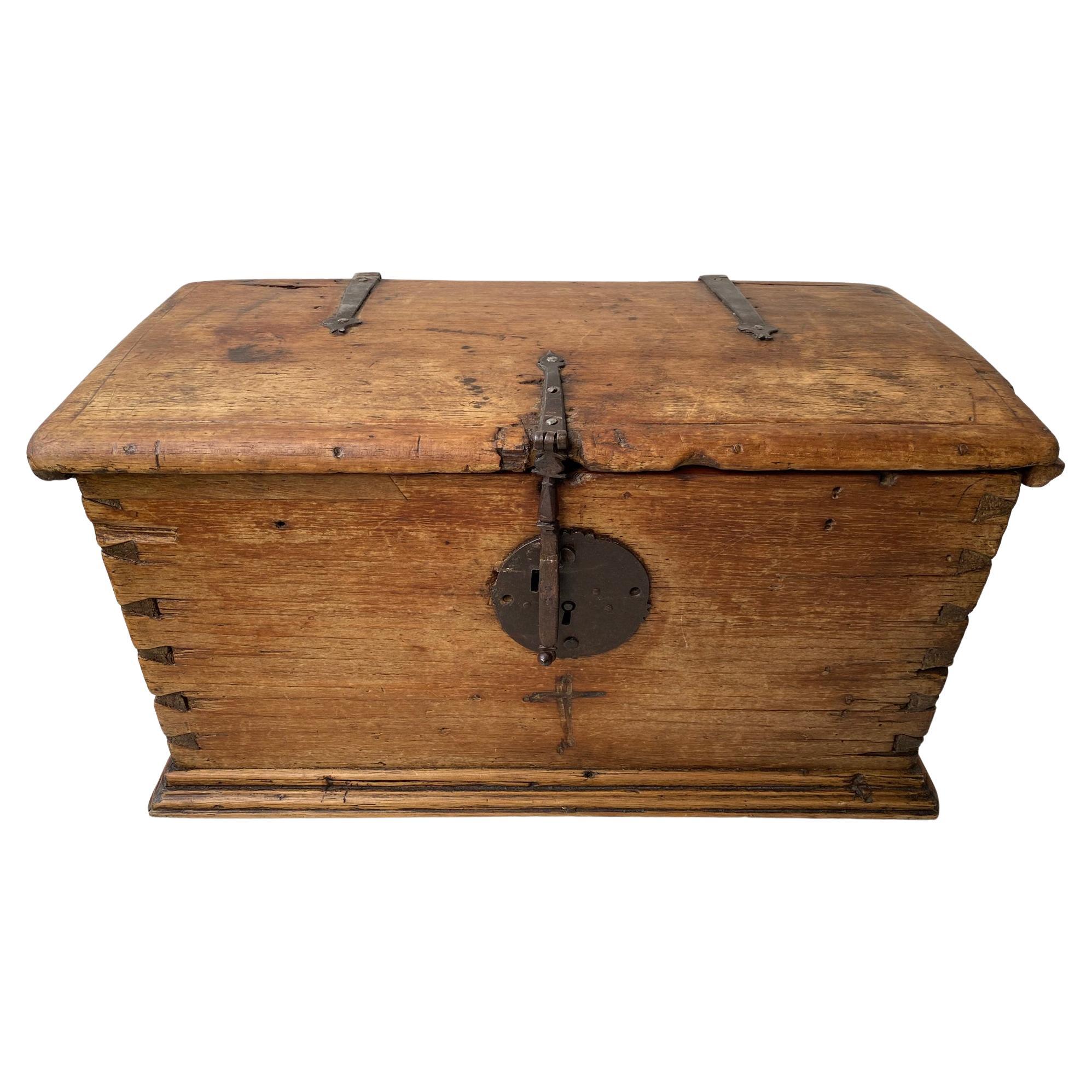 A 19th-century colonial trunk distinguished by its magnificent, hand-crafted joinery. The intricate construction and warm aged patina highlight the skill of early artisans. A rare and sculptural storage piece that adds depth, history, and quiet